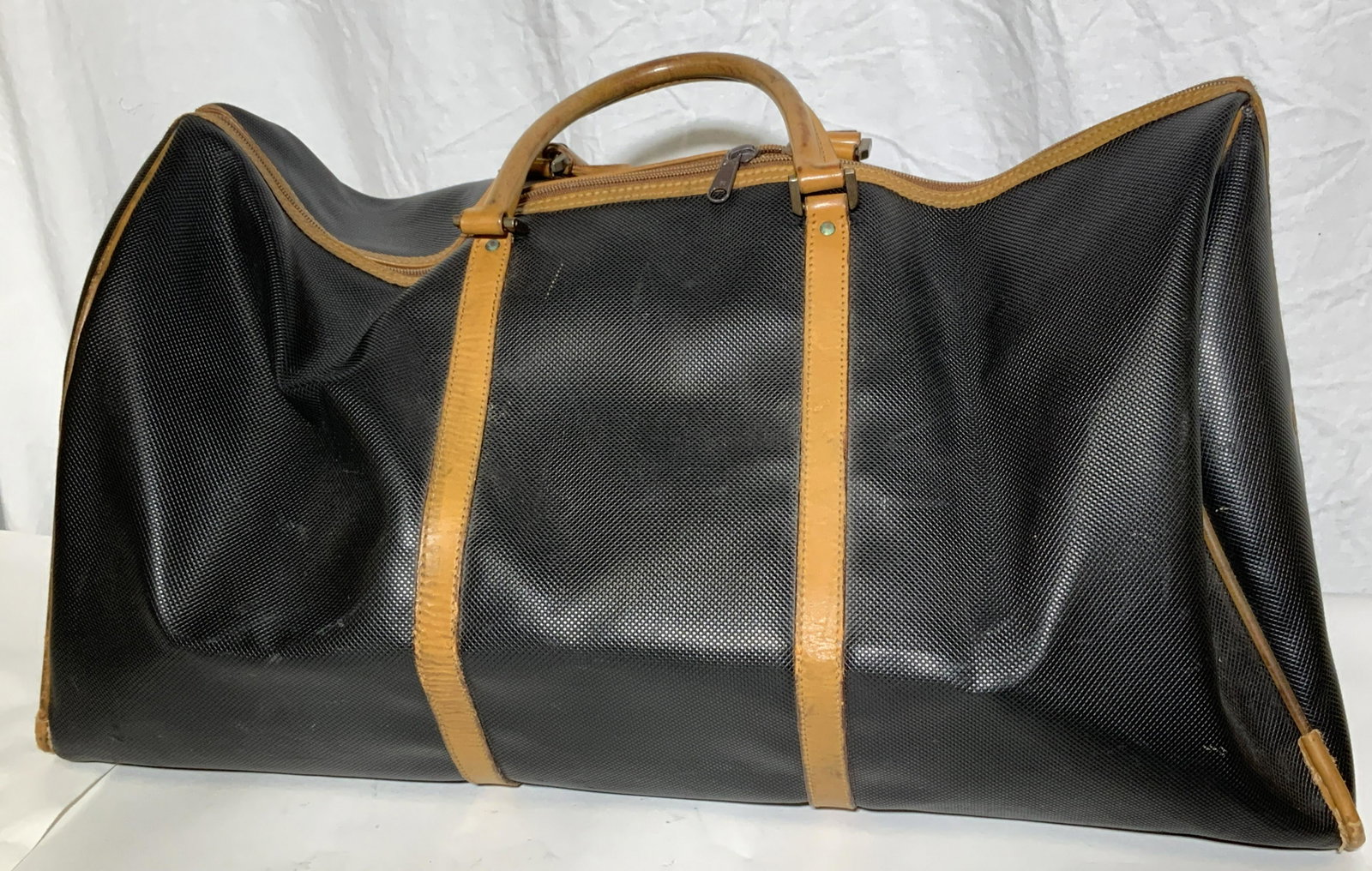 BOTTEGA VENETA Collect. Vntg Duffel Bag, Italy: Vintage Hard Canvas and footed Duffel bag lined with tan leather, Carry handles, cotton fabric Interior lining, SIGNED BOTTEGA VENETA MADE IN ITALY. Zippers fully open from side to side, not just in c