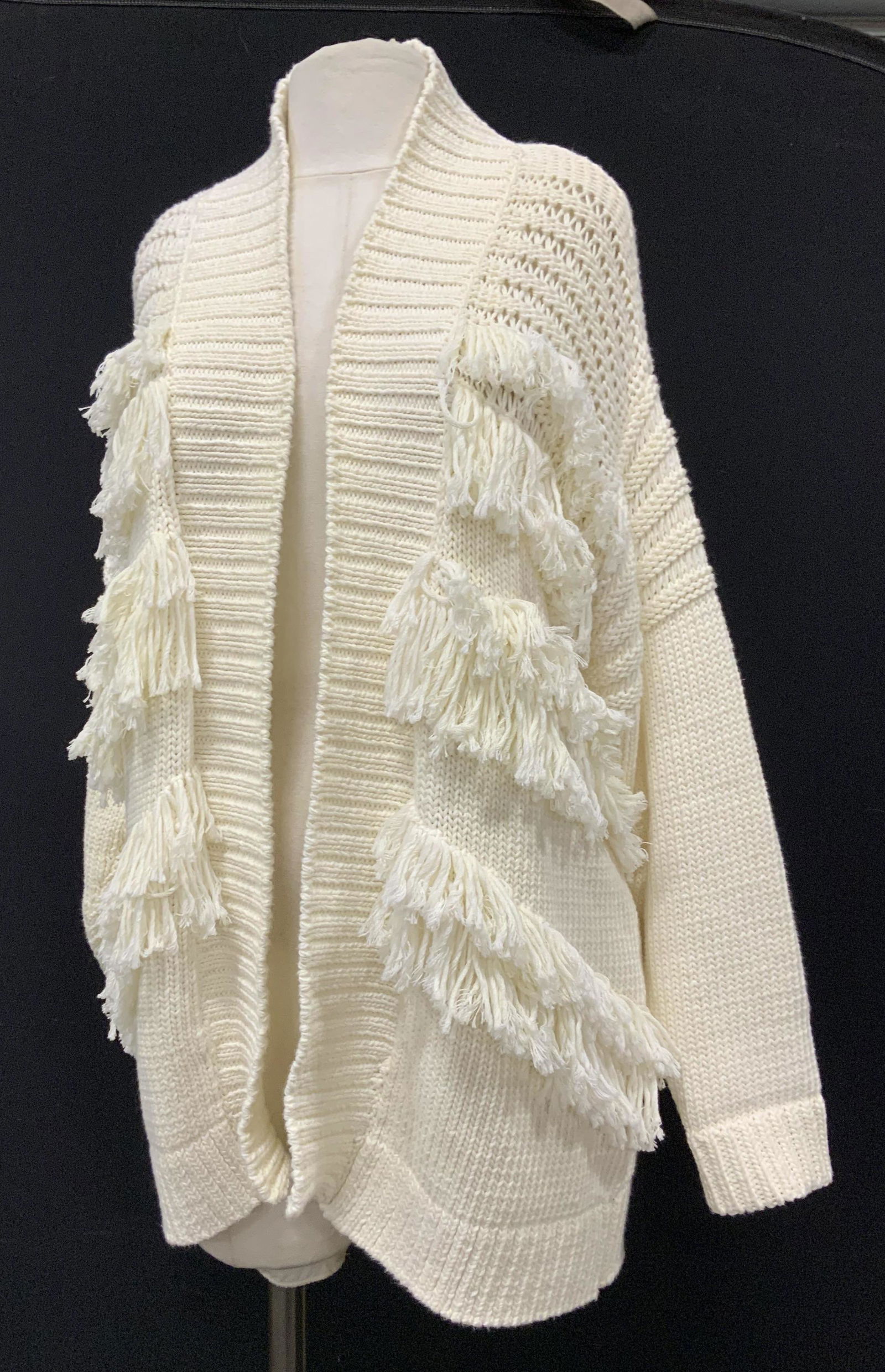 SANDRO Paris Heavy Knit Cotton Cardigan w Tassels: A bohemian fashion by signed designer Sandro France, labeled designer, is this off white knit cotton cardigan with frontside tassels, 29 in long, fits size Med- Large, , long sleeves that can be rolle
