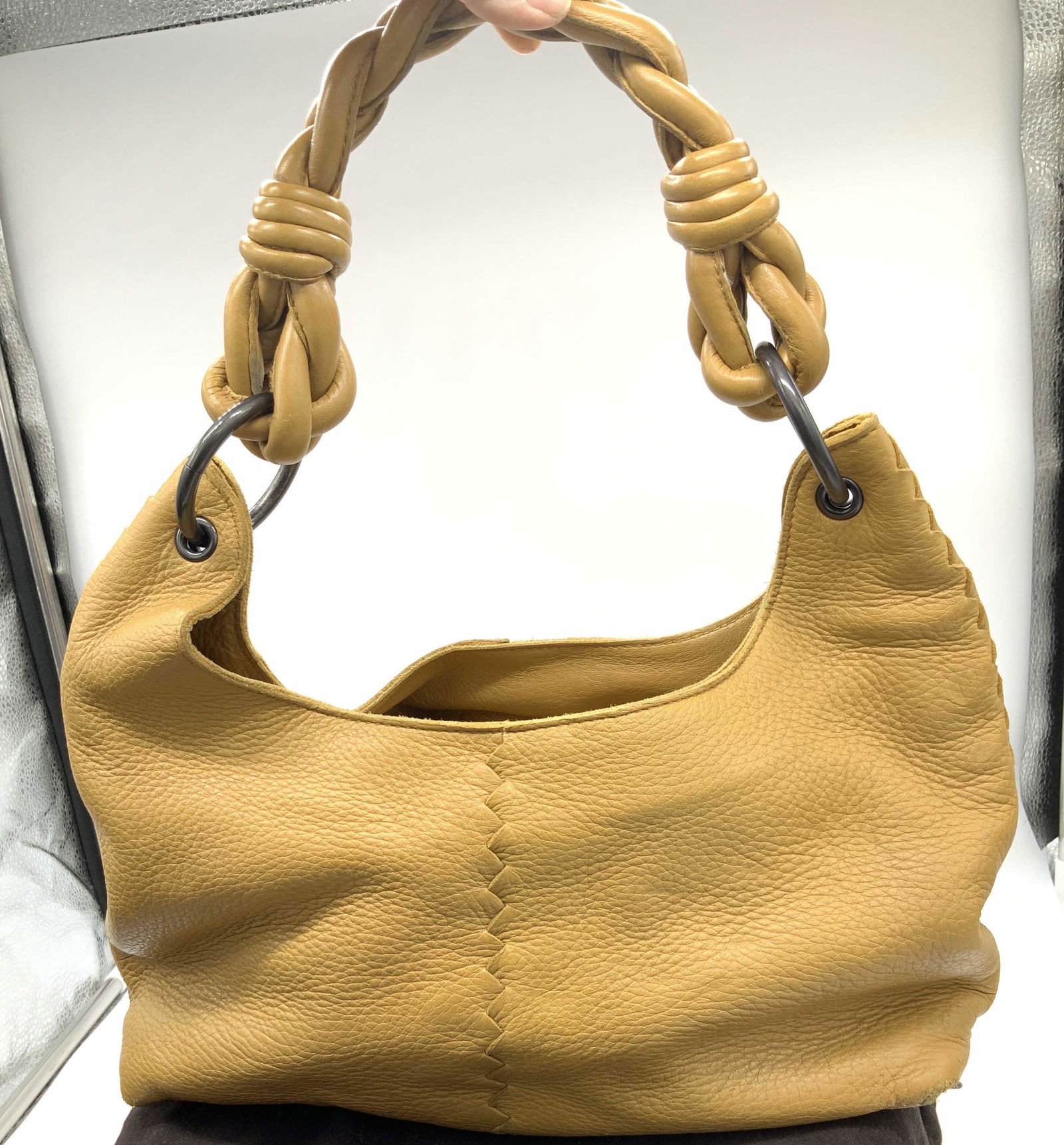 BOTTEGA VENETTA Lux Leather Satchel Bag, Duster: Signed Bottega VENETTA Leather handbag with braided Handle, drop is 9.5 in. and connected to hand ware rings. Super Soft hand pebbled leather, camel/ mustard color, interior all tan leather suede. Zip