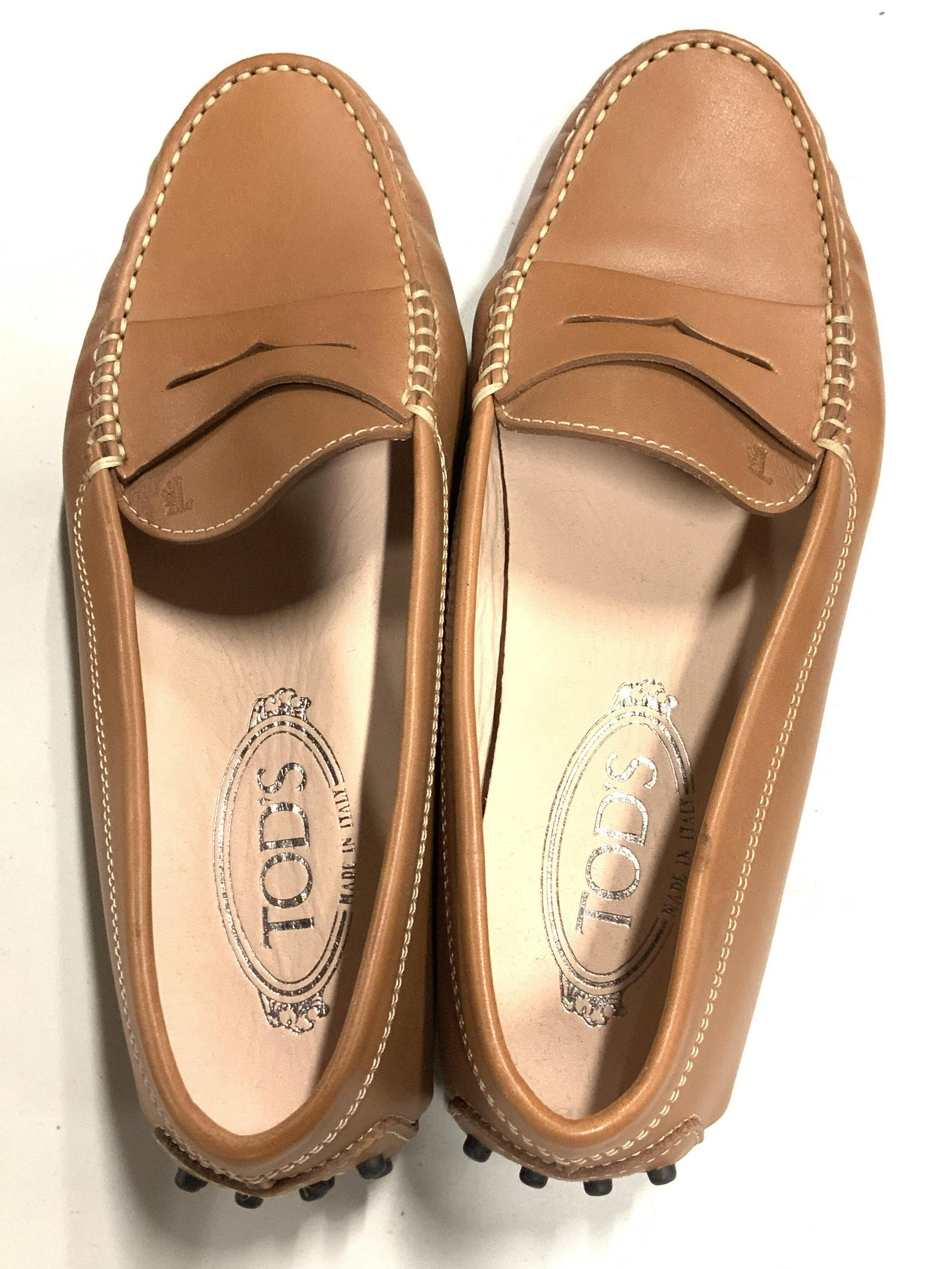 TOD’S Brown Leather Driving Shoes, Never Worn: Signed Todâ€™s Gommino Womenâ€™s Leather Driving shoes, medium brown leather, with exposed hand stitching, penny bar, hot-stamped monogram and iconic rubber pebble outsole. A timeless design