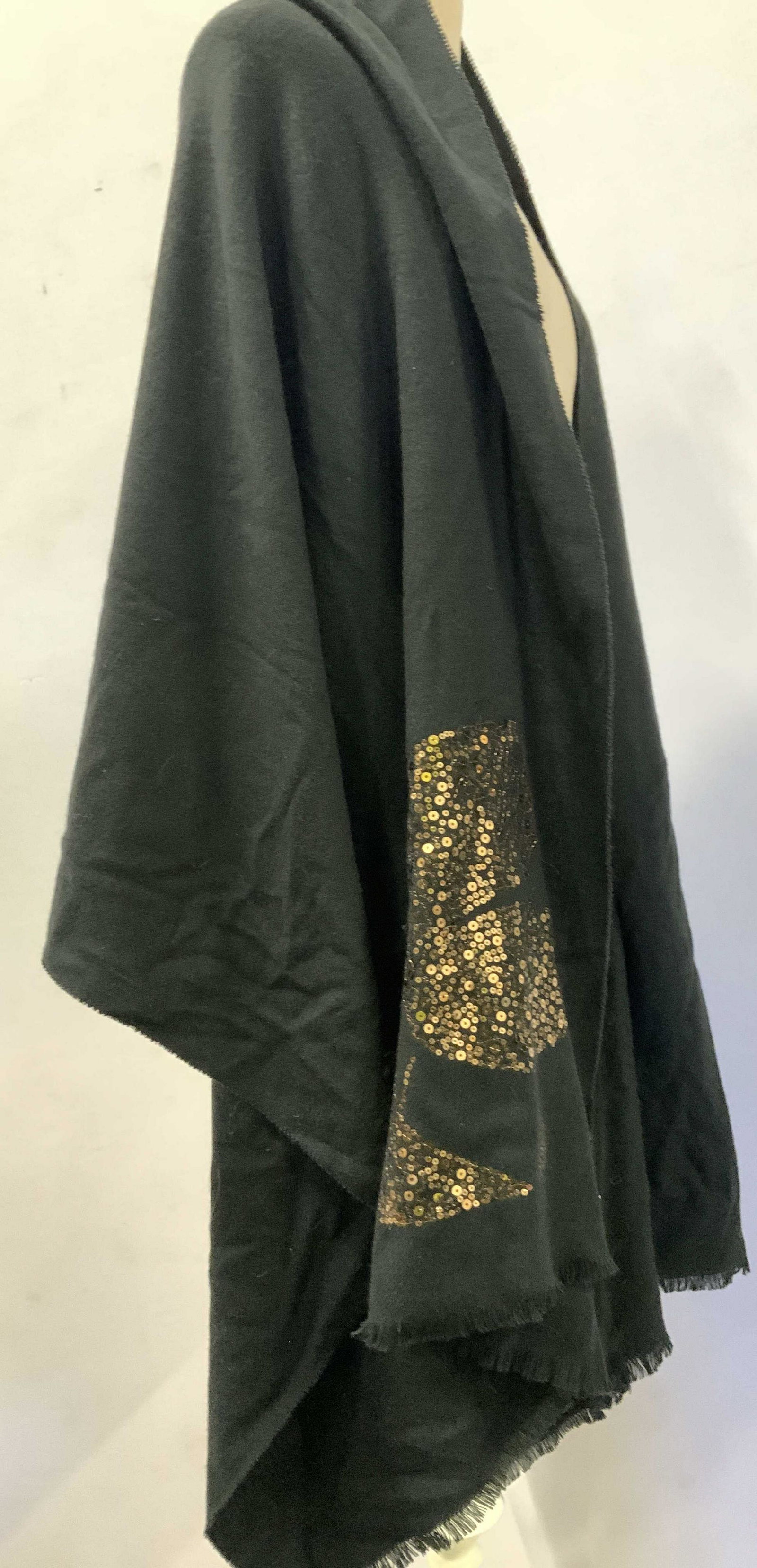 Karl LAGERFELD PARIS Blk Acrylic and Wool Shawl: Large shawl, Black, soft hand, labeled luxury designer Karl LAGERFELD PARIS with fabric tag. Addition sequins design in gold at one corner.26 x 78 in. Property of Manhattan, NY Estate Luxury ladies ac
