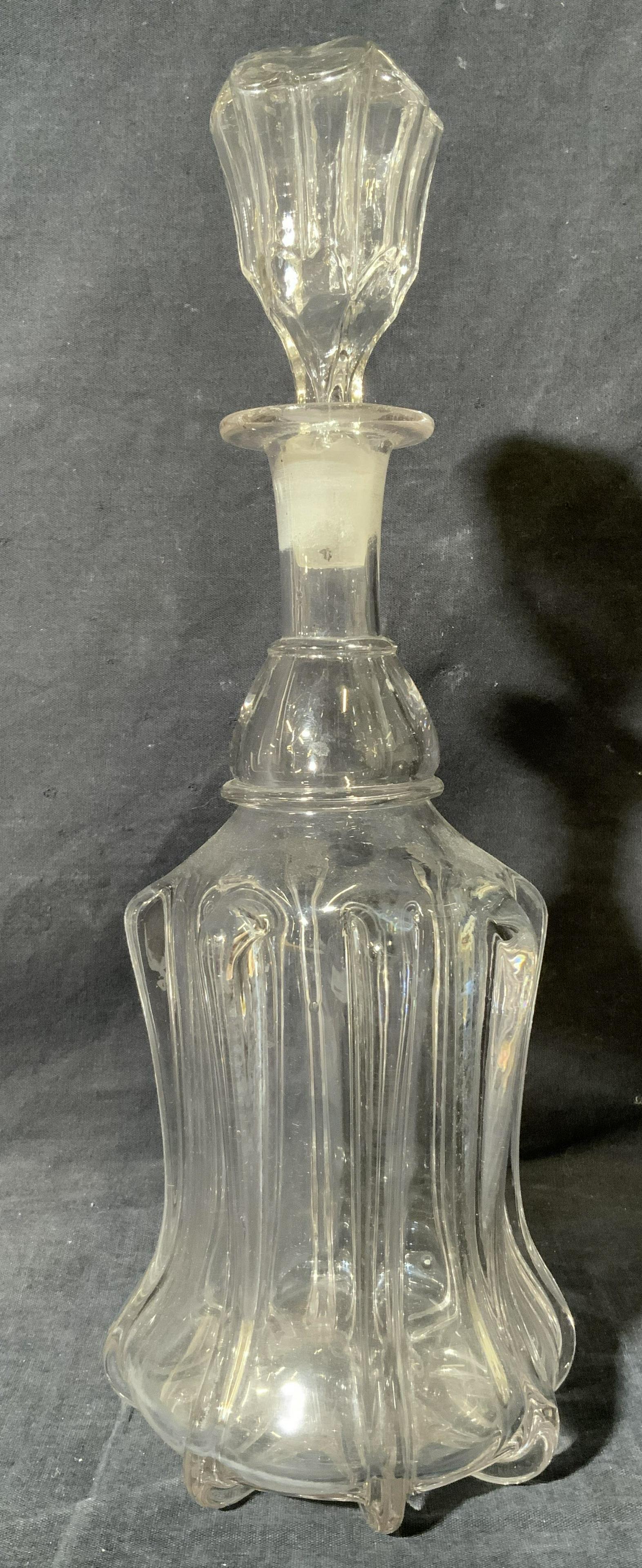 Clear Crystal Decanter: Clear Crystal Decanter, no apparent inscriptions or mark to piece, subject a clear decanter with ribbed design and matching stopper, measures 14 x 5 x 5 inches, surface wear to piece. Home decor, deco