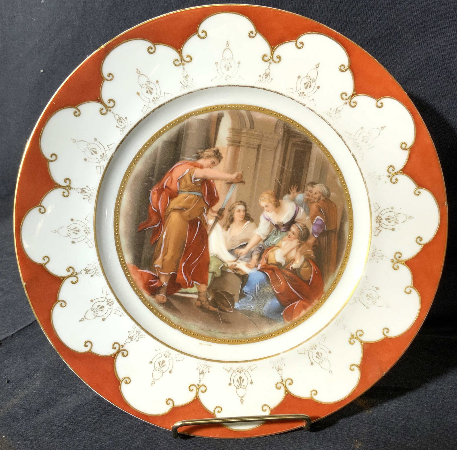 ROYAL BAVARIA Porcelain Plate: Underside of piece is marked ROYAL BAVARIA BROWD MEDER ARISTOCRAT CHINA HAND DECORATED KARLSBAD CZECHOSLOVAKIA. Plate is porcelain. Piece depicts multiple figures. Rim of plate is red orange toned wit