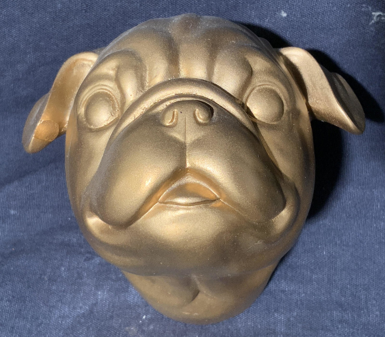 Wall Hanging Composite Pug Head: Wall Hanging Composite Pug Head, no apparent inscriptions or mark to piece, subject a bronze toned composite pig head, measures 4 x 4 x 4 inches, surface wear to piece. Artwork, fine art, wall art, wa