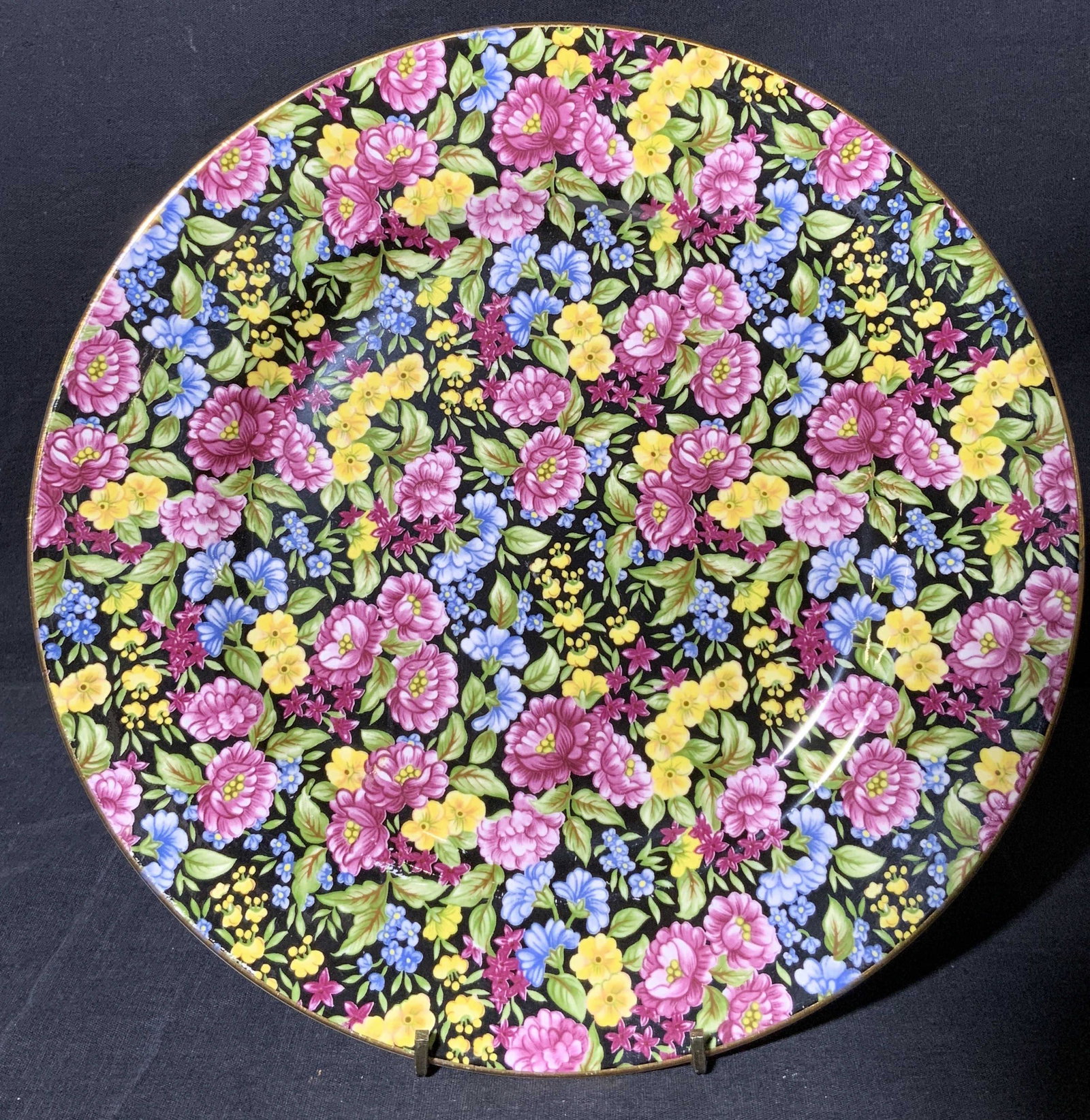 BETHANY FINE BONE CHINA Floral Plate: BETHANY FINE BONE CHINA Floral Plate, marking to underside reads ‘BETHANY FINE BONE CHINA’, subject a black toned background with pink and yellow toned flower pattern, measures 10 1/2 x 10 1/2 inc