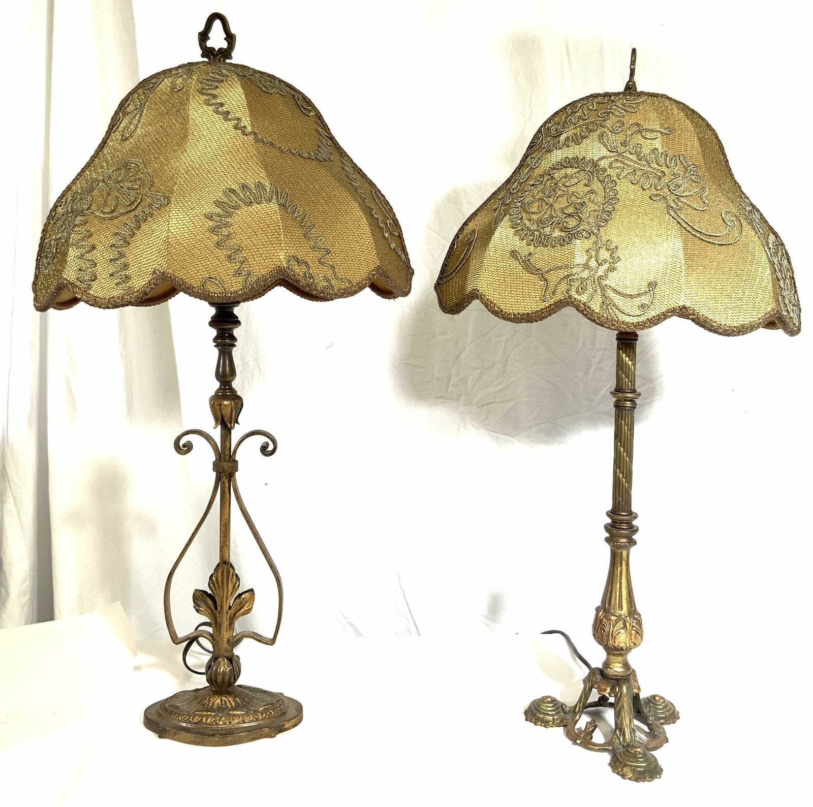 Lot 2 Brass Near Pair Lamp W Matching Shades: Lot includes 2 lamps. Each are gold toned & appear to be brass. Each shade is gold toned with olive toned embroidered detail & gimp style edges. Lamps each include harps & finial. One lamp is slightly