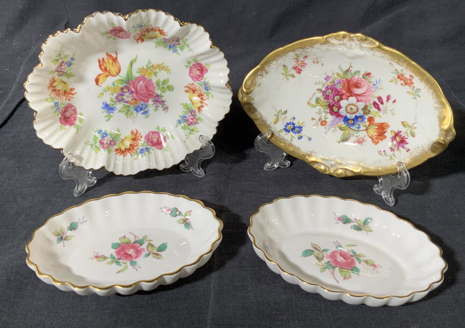 Group Lot of 4 Porcelain Dishes: A group lot of 4 porcelain dishes a set of 2 with scalloped gold gilt rim with floral motifs in the center with â€˜Spode Bone China England Billingsley Rose Sprayâ€™ on underside. Another dis