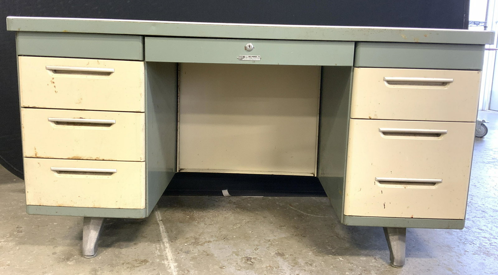 Vintage Retro STEELMASTER Desk: Desk has metal tag which reads STEELMASTER. Piece is vintage w retro styling. Desk has cream & seafoam tones. Piece has 6 drawers. Piece has silver toned metal feet. Piece measures approx 55 inches lo