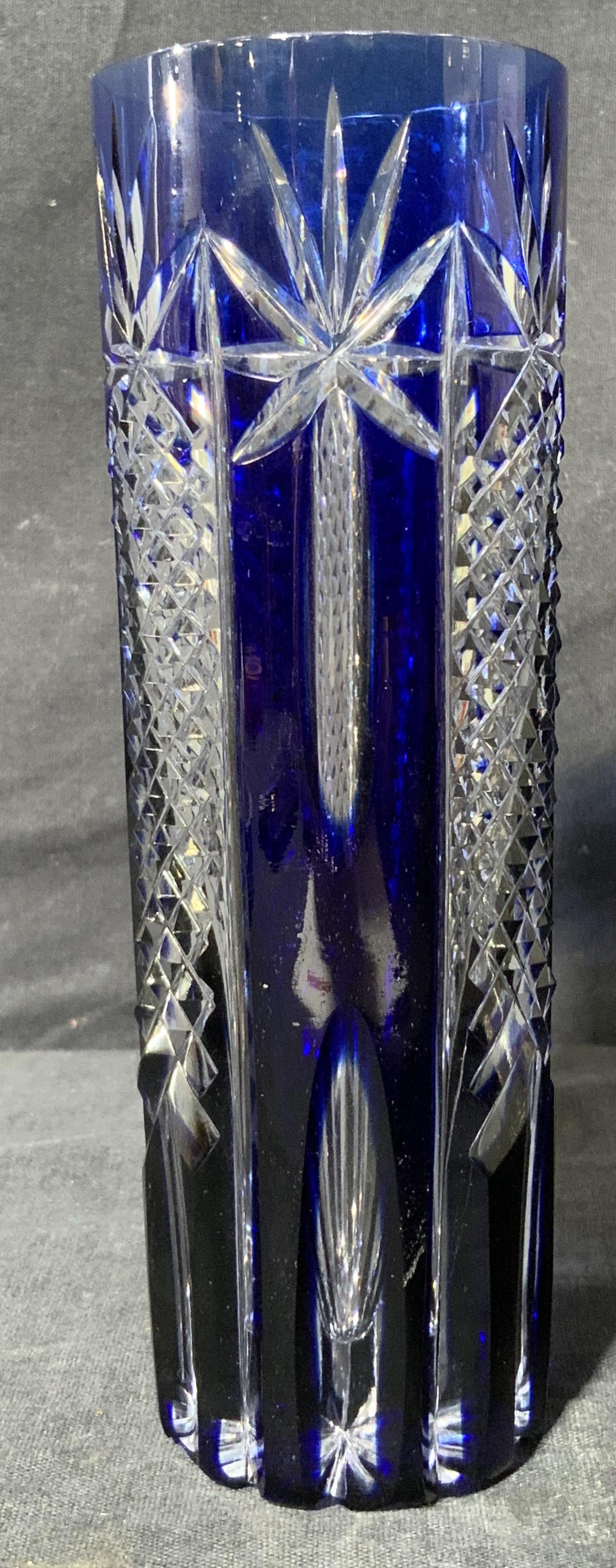 Cobalt Blue Crystal Cut to Clear Cup: Cobalt Blue Crystal Cut to Clear Cup, no apparent inscriptions or mark to piece, subject a cobalt blue cut to clear tall weighty cup, measures 6 1/2 x 2 1/4 x 2 1/4 inches, surface wear to piece. Artw