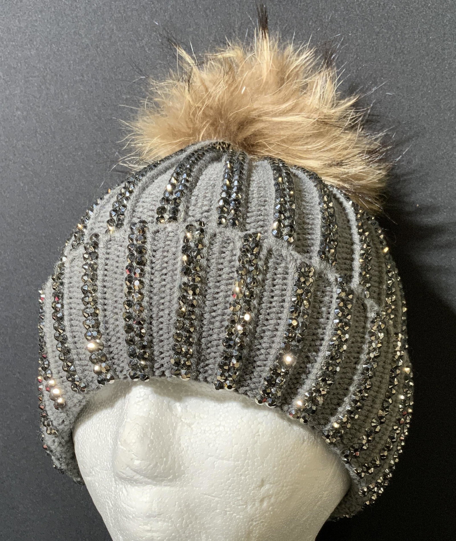 Knit Hat w Pom Pom: Knit hat. One Pom pom affixed to top of hat. Slate gray toned. Wear is consistent with age and use. Decorated with gun metal toned studs. Hat wearables, winter hat, knit wool hat, fashion accessories,