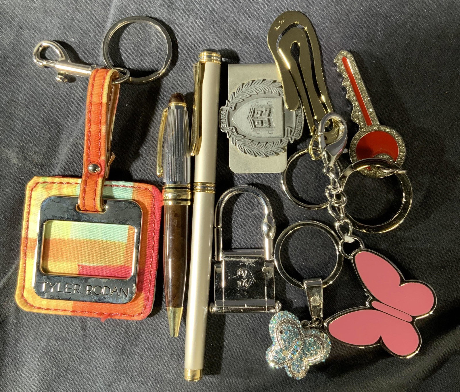 Group Lot Key chains pens enamel and more: Money clip, two desk pens, 6 key chains, largest key chain measures 6 inches, Tyler Rodan,money clip reads Yale university with school motto, other brands