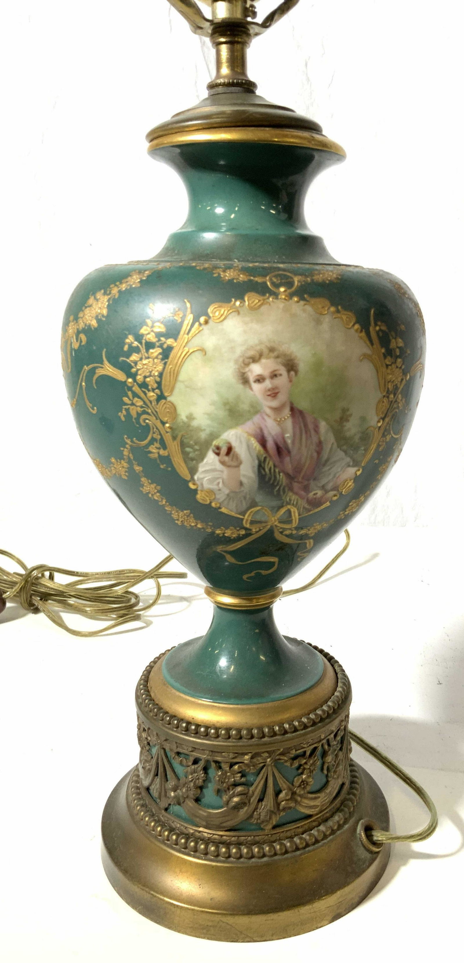 Vintage Hand Painted Porcelain Lamp: Emerald green tone, medallion of landscape scene, medalian of female portrait, paste up gold painted accents, to top of harp measures 25 inches, porcelain urn shaped base measures 13 inches,possibly a
