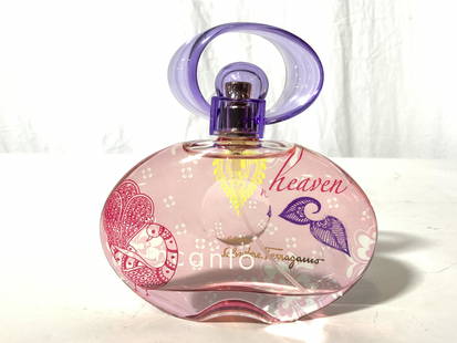 SALVATORE FERRAGAMO INCANTO Perfume In Bottle: Perfume bottle reads SALVATORE FERRAGAMO INCANTO. Bottle has purple pink & yellow toned peacock, floral, leaf & geometric detail. Bottle measures approx 5 inches tall 4.5 inches wide. Perfume bottle i