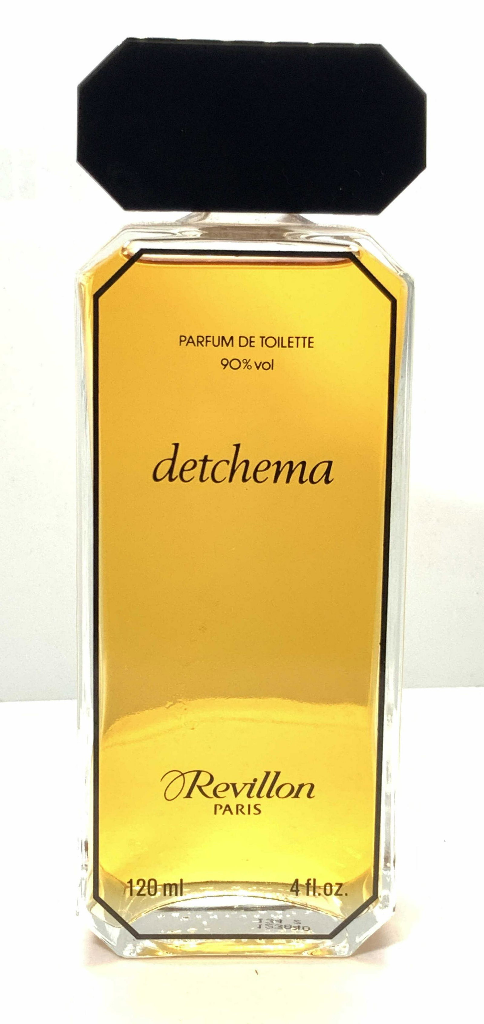 DETCHEMA By REVILLON Perfume Bottle: Detchema by Revillon Paris reads â€˜detchema and Revillon Parisâ€™ on obverse side of bottle. Cap is twist off. Bottle is partially full with perfume. Bottle is approximately 5.75 in tall and