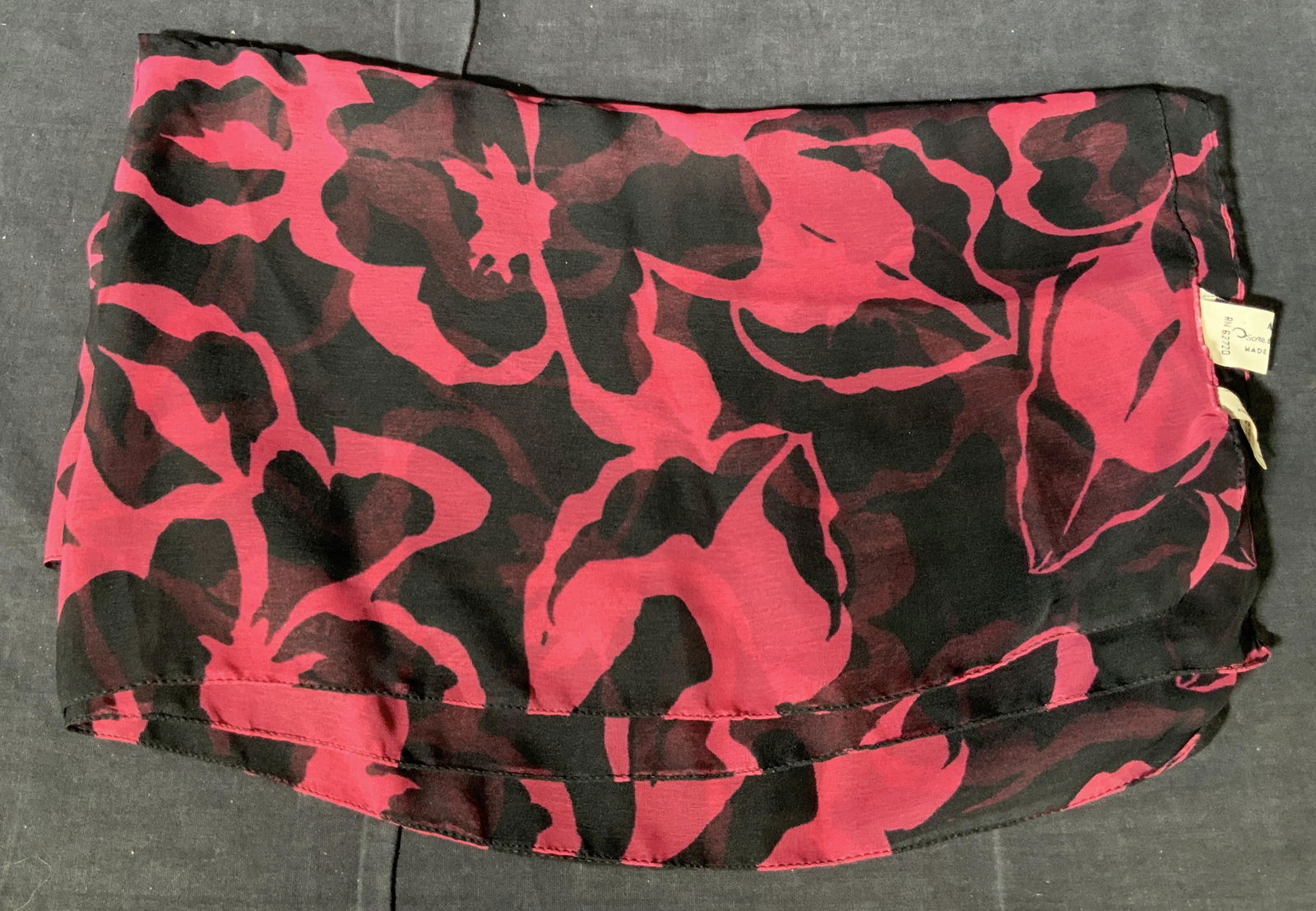 OSCAR DE LA RENTA Floral Polyester Scarf: A Hand rolled Oscar de la Renta scarf marked on tag ‘Oscar de la renta’ and ‘100% Polyester’ with black and magenta toned threading with floral pattern throughout. Approximately 19 in wide and