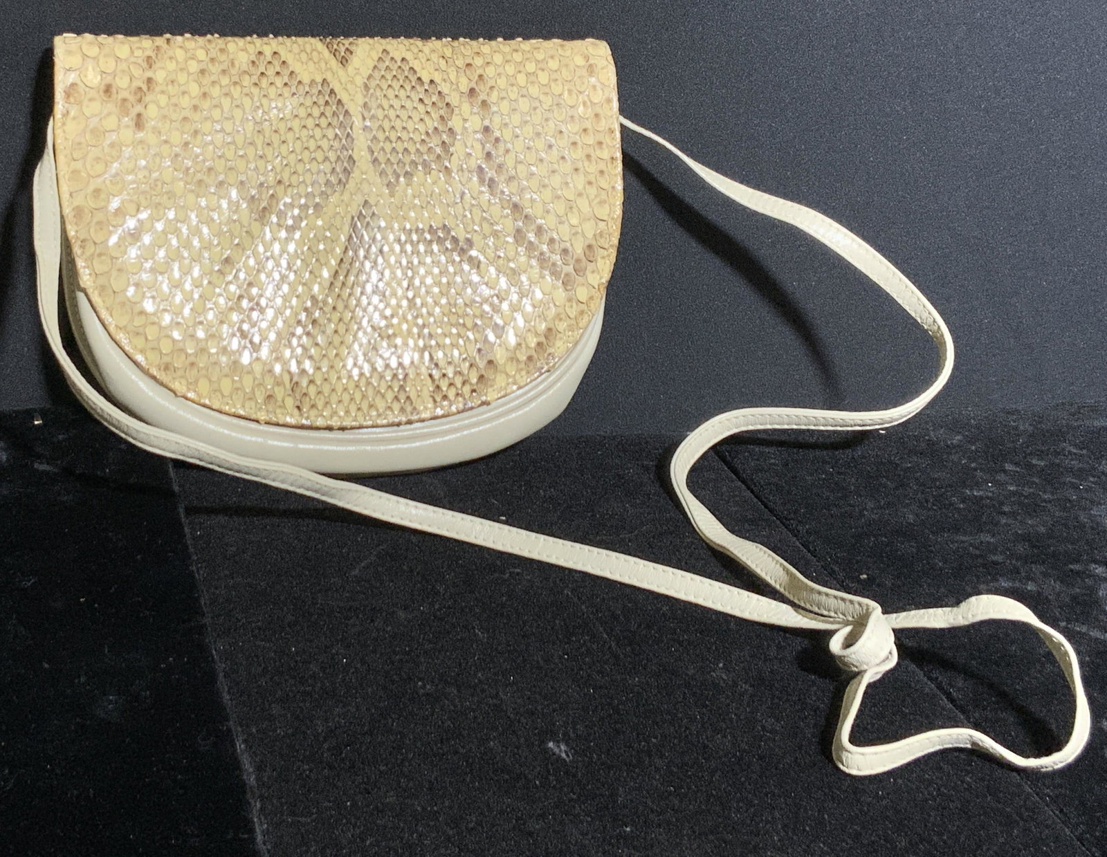 Vtg HALSTON Snakeskin & Leather Style Shoulder Bag: A vintage cream toned purse with snakeskin and leather style accents. Snap button closure. Piece has some discoloration. Some wear consistent with vintage age and use. Bag measures approx 6L x 7.5W in