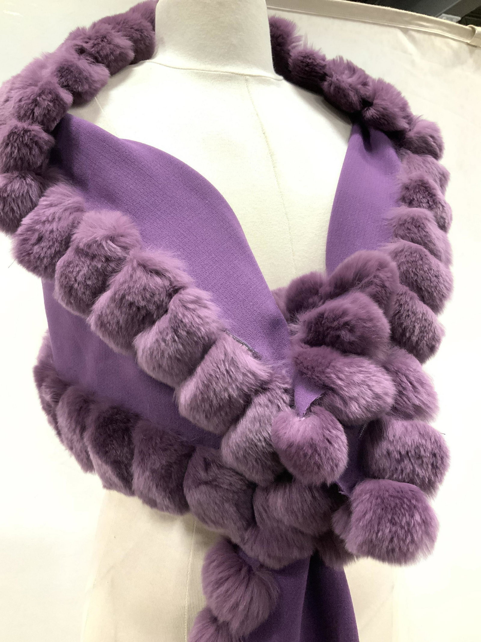 GLAMOURPUSS NYC Rabbit & Poly Lux Shawl: Dyed rabbit fur and polyester fabric, both eggplant color. Perfect shawl for a special event. Entire trim is rabbit fur, fabric is polyester, signed designer label and care instructions. 14.5 x 66 in.