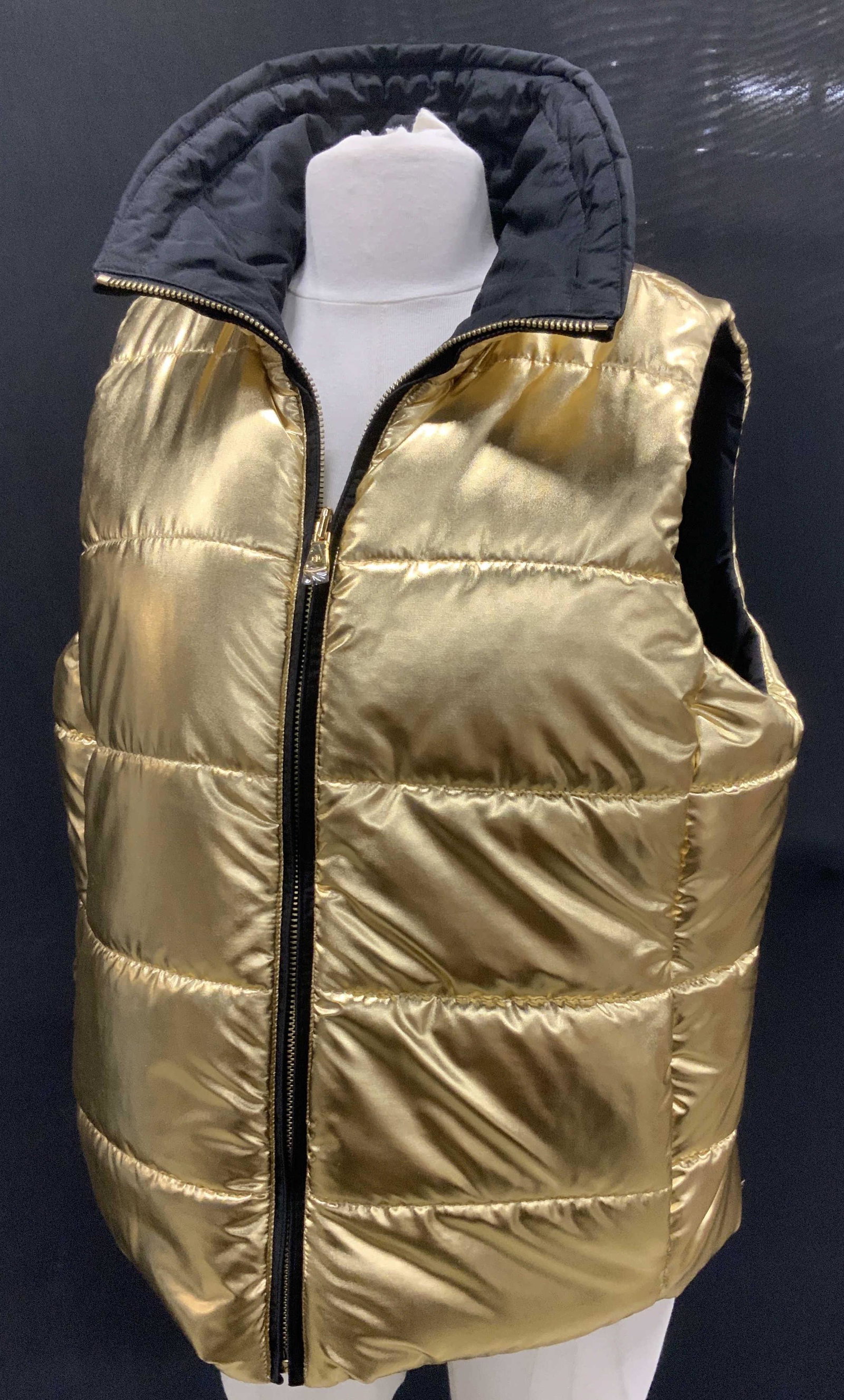 Ralph Lauren Never Worn Reversible Puffer Vest: Size Large. Lauren by Ralph Lauren Puffer Vest, dressy for nighttime, casual for a day walk. One side all gold metallic, the other side all black. Buttons and zipper signed LRL and Ralph Lauren. 25 in
