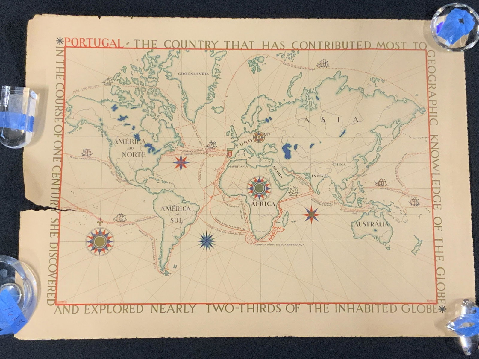 Vintage Portuguese Map of the World: Vintage Portuguese Map of the World, words surrounding map read â€˜Portugal the country has contributed most to the geographic knowledge of the globeâ€™, measures 19 1/2 x 27 inches, not fram