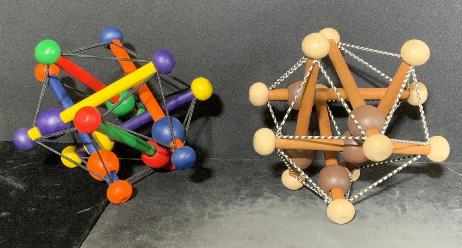 Lot 2 MANHATTAN TOY CO. SKWISH Wooden Toys: Lot of 2 wooden toys. Marked THE MANHATTAN TOY COMPANY. Includes â€˜The Artful Skwishâ€™, and â€˜SKWISH Classicâ€™. Each measures approx 5.5 inches h and 6.5 inches w. Baby toy, ratt