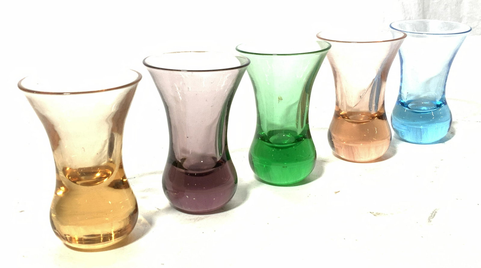 Set 5 Colored Glass Shooters: Vintage Festive Barware to entertain your guests. Set of 5 shooters, glass colors are amber, amethyst, emerald, pink, and neon blue. Measure 3 x 1.75 in. Festive Barware, Shooters, Colored Glass Shoot