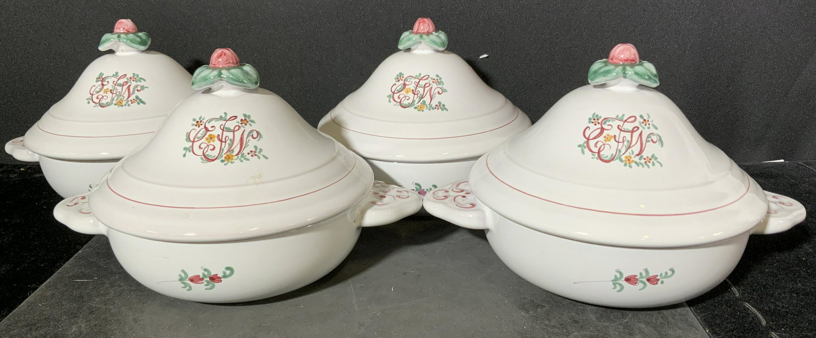 Group Lot 4 French Faience Soup Tureens: Underside of tureens are marked ATELIER DE SEGRIES a MOUSTIERS FRANCE DY 539. Piece is white toned with multi toned floral and leaf detail, lid finial resembles a flower. White glaze over earthenware.