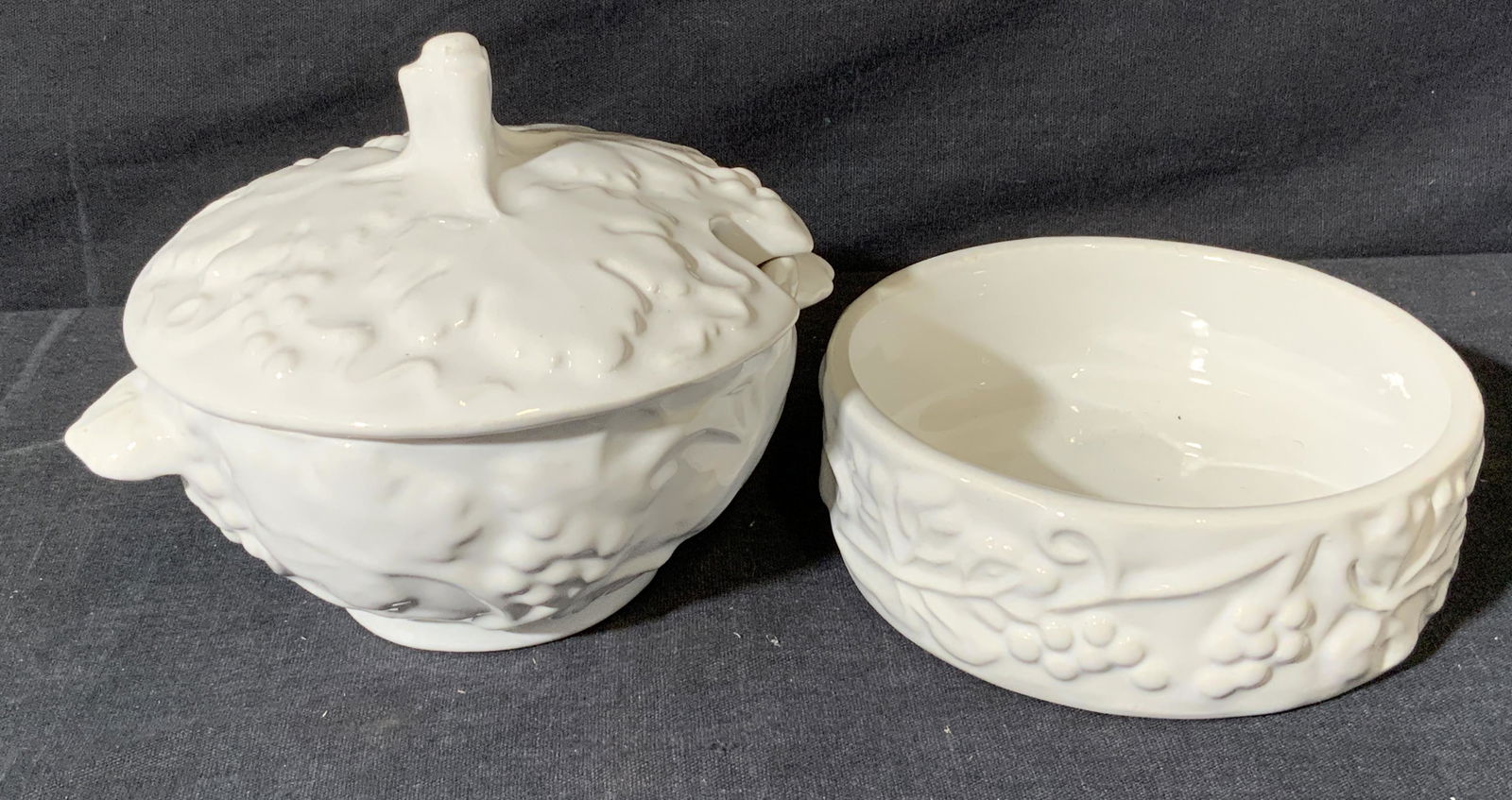 Italian Grape Vine Sugar Bowl and Wine Coaster: Italian Grape Vine Sugar Bowl and Wine Coaster, underside reads â€˜MADE IN ITALYâ€™, white toned ceramic lidded sugar bowl and wine coaster, both diameters measure 4 1/4 inches across, surfac