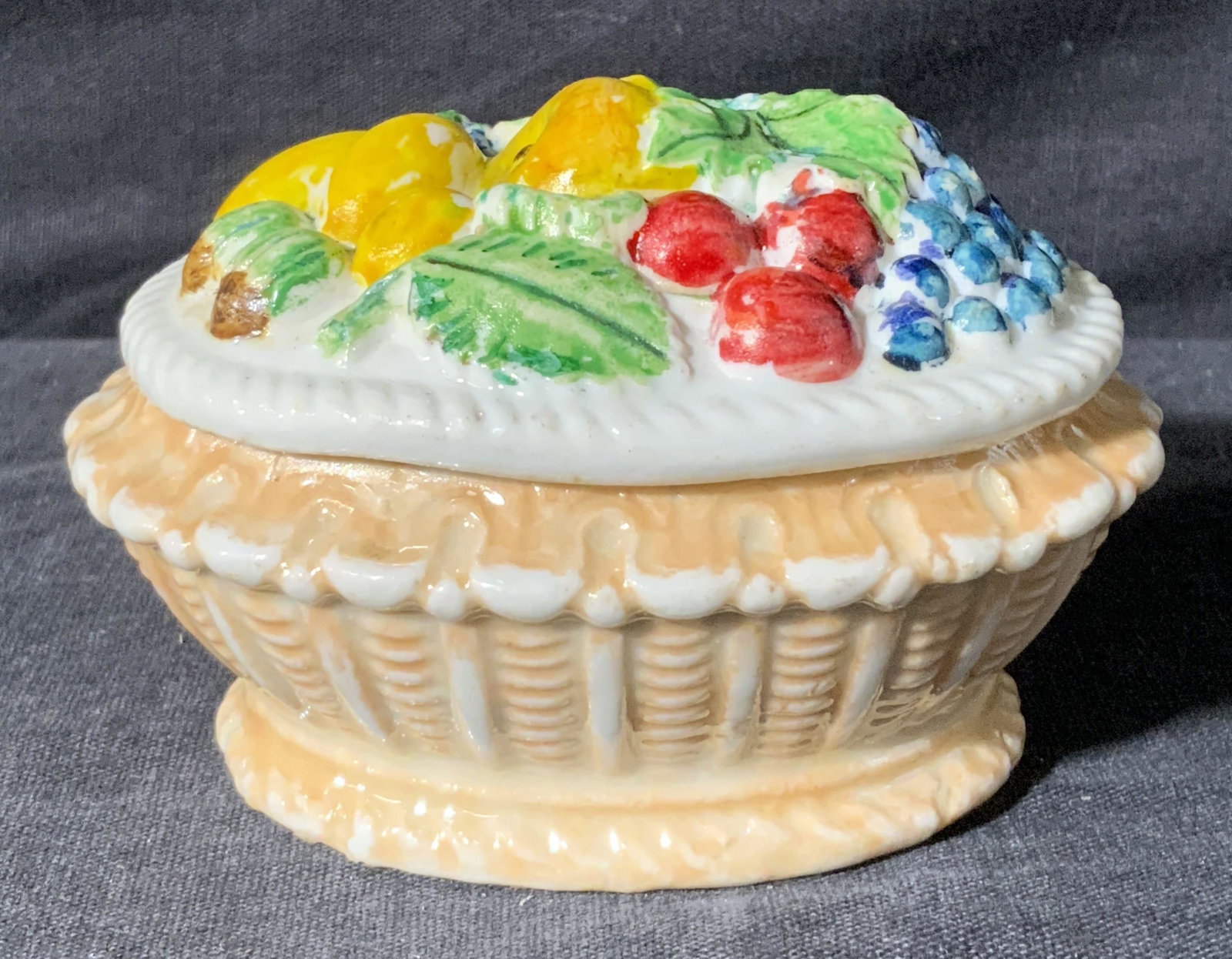 MEISSEN Fruit Motif Lidded Porcelain Trinket Dish: MEISSEN Fruit Motif Lidded Porcelain Trinket Dish, markings to underside MEISSEN crossed swords, lidded porcelain box with likeness to a fruit basket, measures 2 1/2 x 3 1/2 x 3 inches, surface wear t