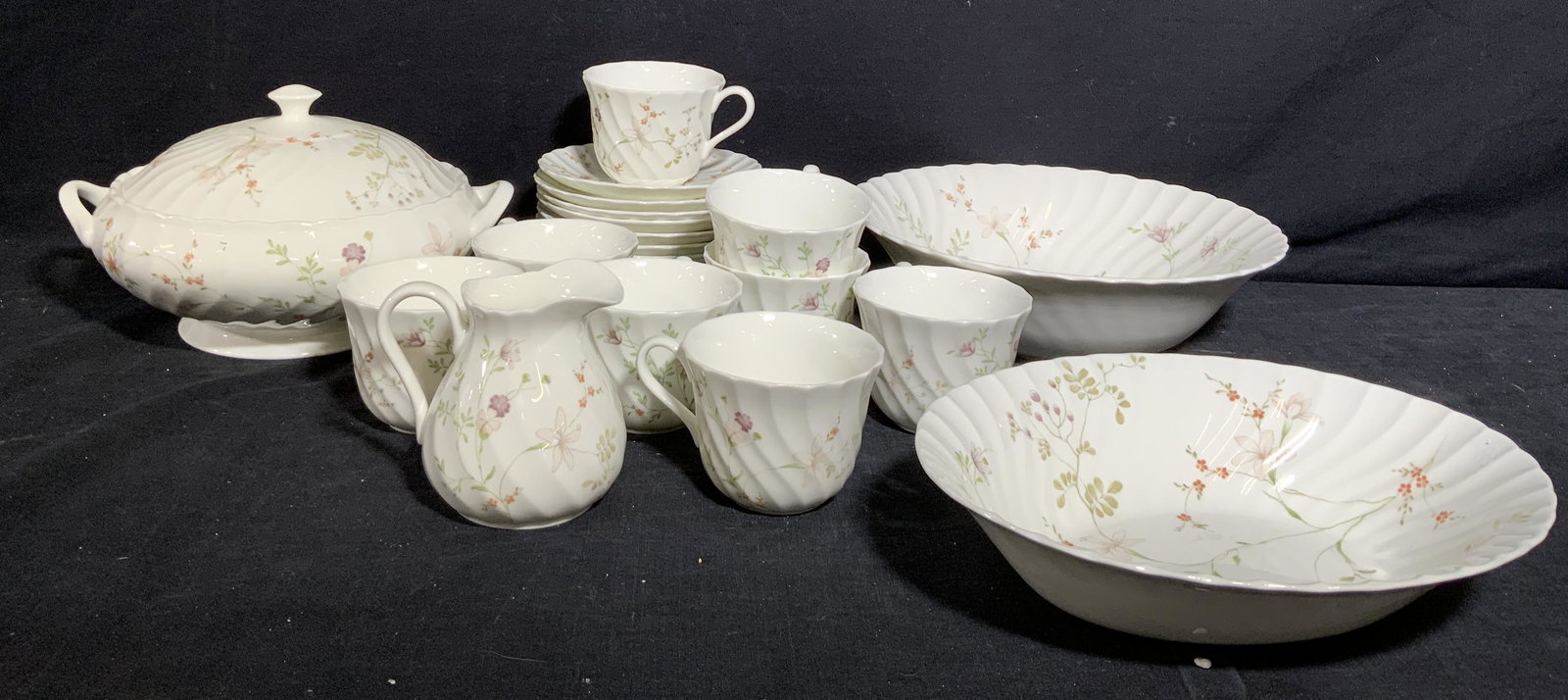 WEDGEWOOD CAMPION CHINAWARE, ENGLAND: White porcelain dinnerware with green and warm toned florals, called CAMPION by Wedgewood. All trademarked under glaze â€˜WEDGEWOOD BONE CHINA MADE IN ENGLANDâ€™ . Set includes large platter 