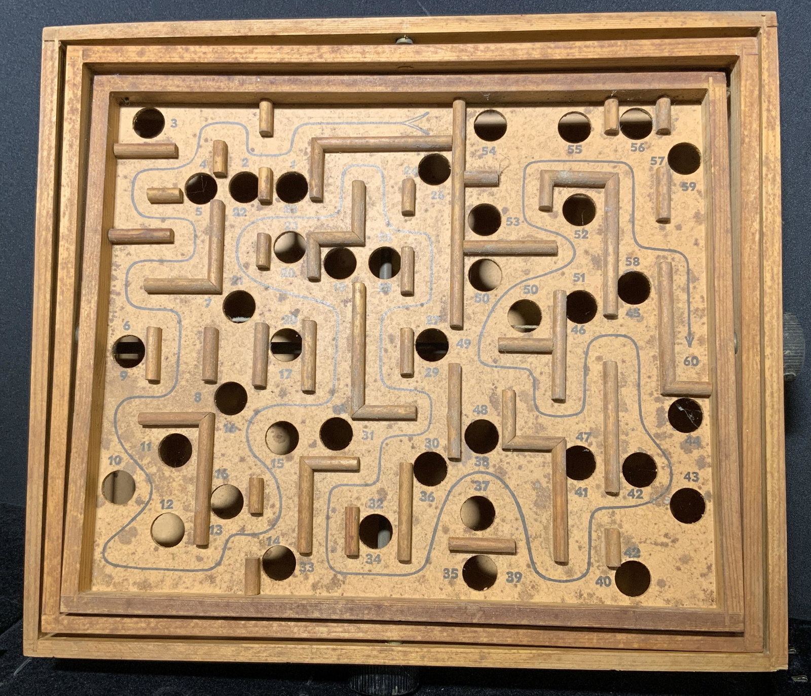 Wooden BRIO Labyrinth Game: Vintage wooden labyrinth game, by Brio. Knob manipulate pitch of game board. Label reads as â€˜BRIO LABYRINTSPEL, SWEDENâ€™. Wear is consistent with age and use, loss present. Measures approx