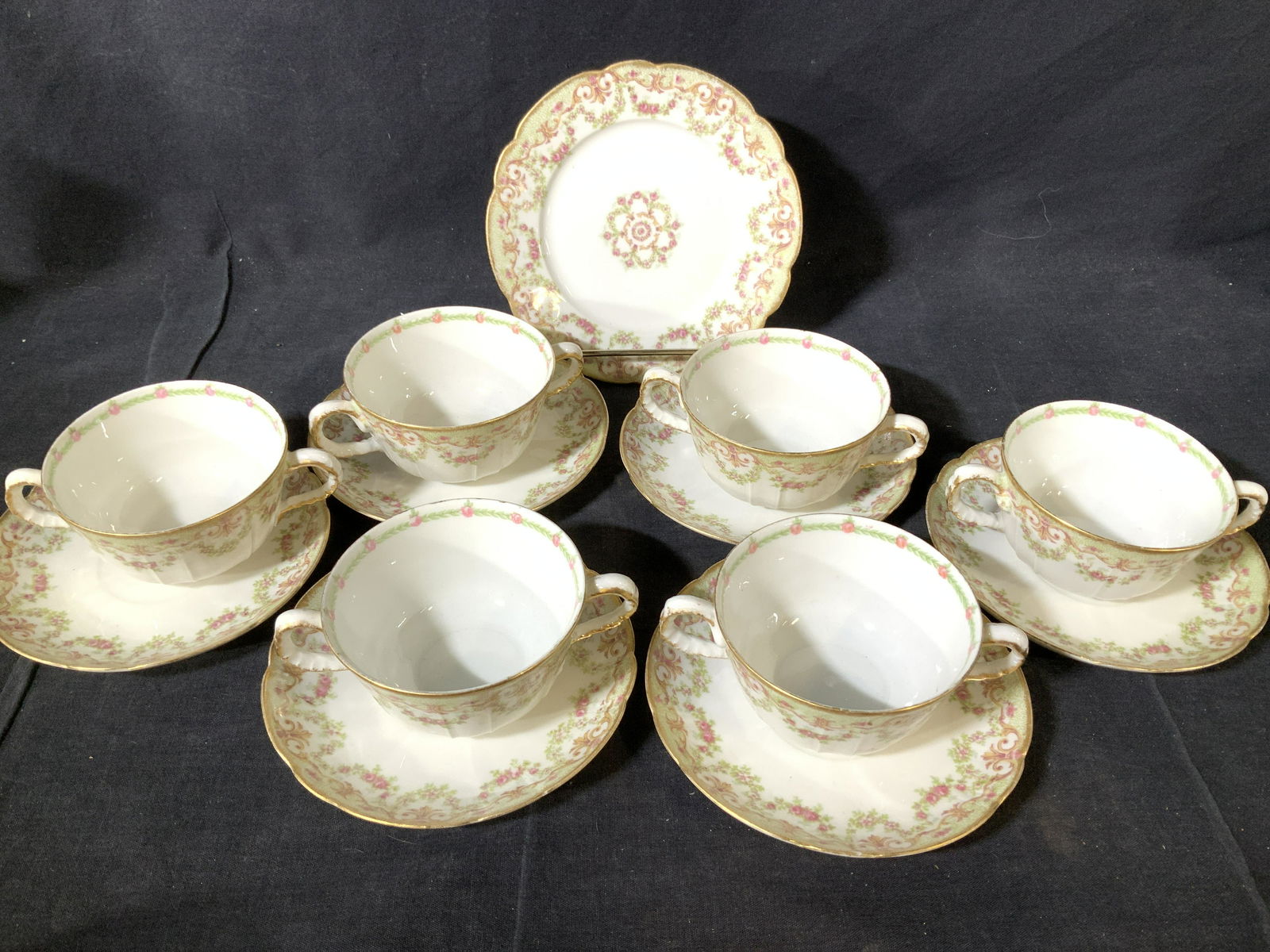 L S& s Limoges France Teacups and Saucers, more: Total pieces 18. Set 13 PL/ L S & S Limoges France tea cups and saucers with an extra dessert plate. All stamped. Victorian floral decor on white porcelain. Cups are double handle, measure 1.75 in. Ht