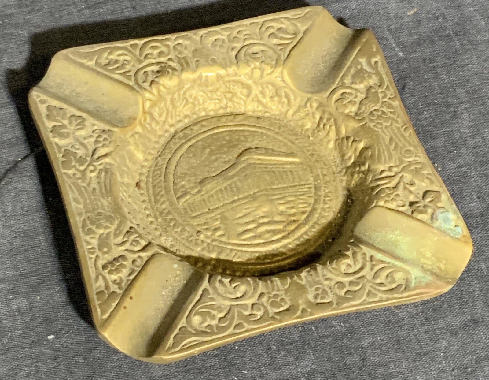 Small Tabletop Brass Parthenon Motif Ashtray: Small Tabletop Brass Parthenon Motif Ashtray, possibly brass, possibly Parthenon, measures 3 3/4 inches sq. Wear consistent with age and use. Property of Central Park West Manhattan New York Estate. D