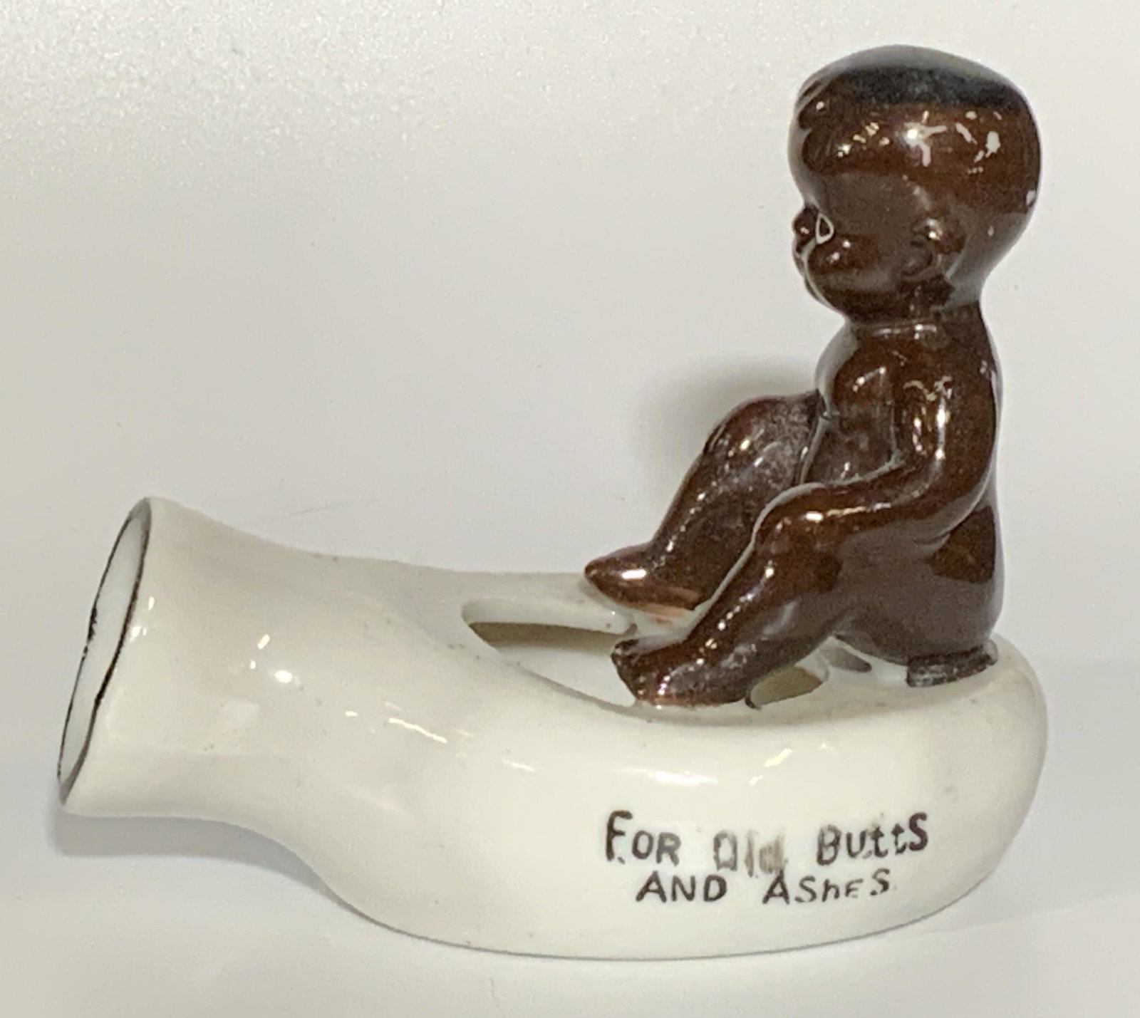 FOR OLD BUTTS AND ASHES Porcelain Ashtray: FOR OLD BUTTS AND ASHES Baby Motif Porcelain Ashtray, underside reads JAPAN, measures 4 X 3 1/8 INCHES, wear consistent with age and use. Decor, decorative ash tray, decorative porcelain ashtray, ash 