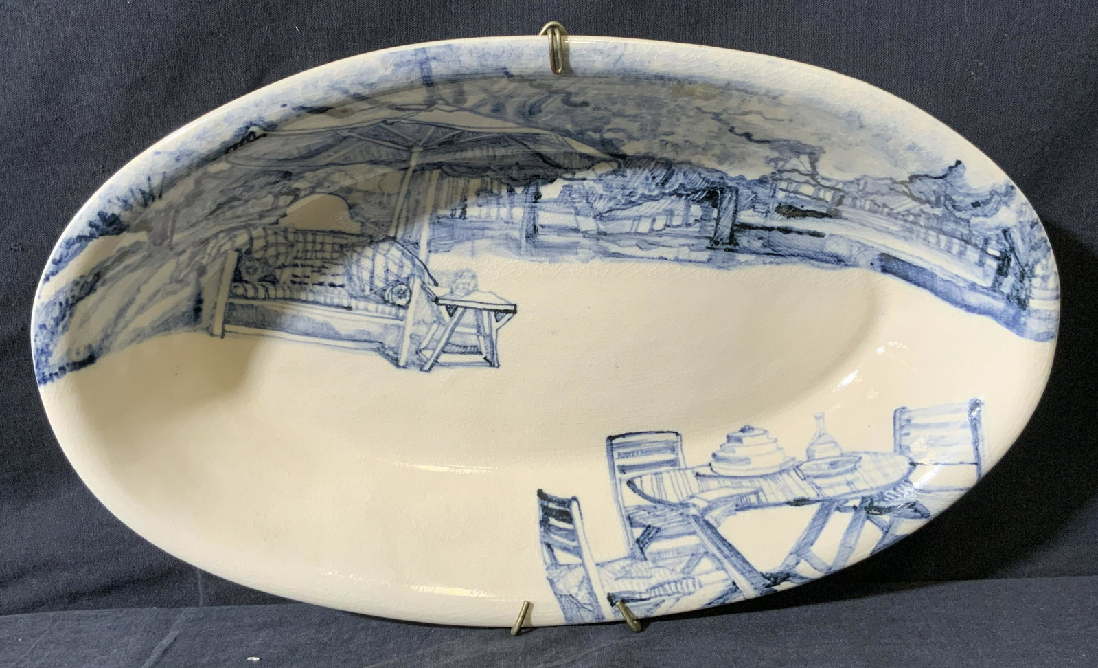 SUZANNE SLOAN LEWIS Porcelain Serving Dish: SUZANNE SLOAN LEWIS Porcelain Serving Dish, signature to underside reads SUZANNE SLOAN LEWIS, white toned porcelain with blue toned detail and handing hardware affixed to underside, measures 14 x 8 3/