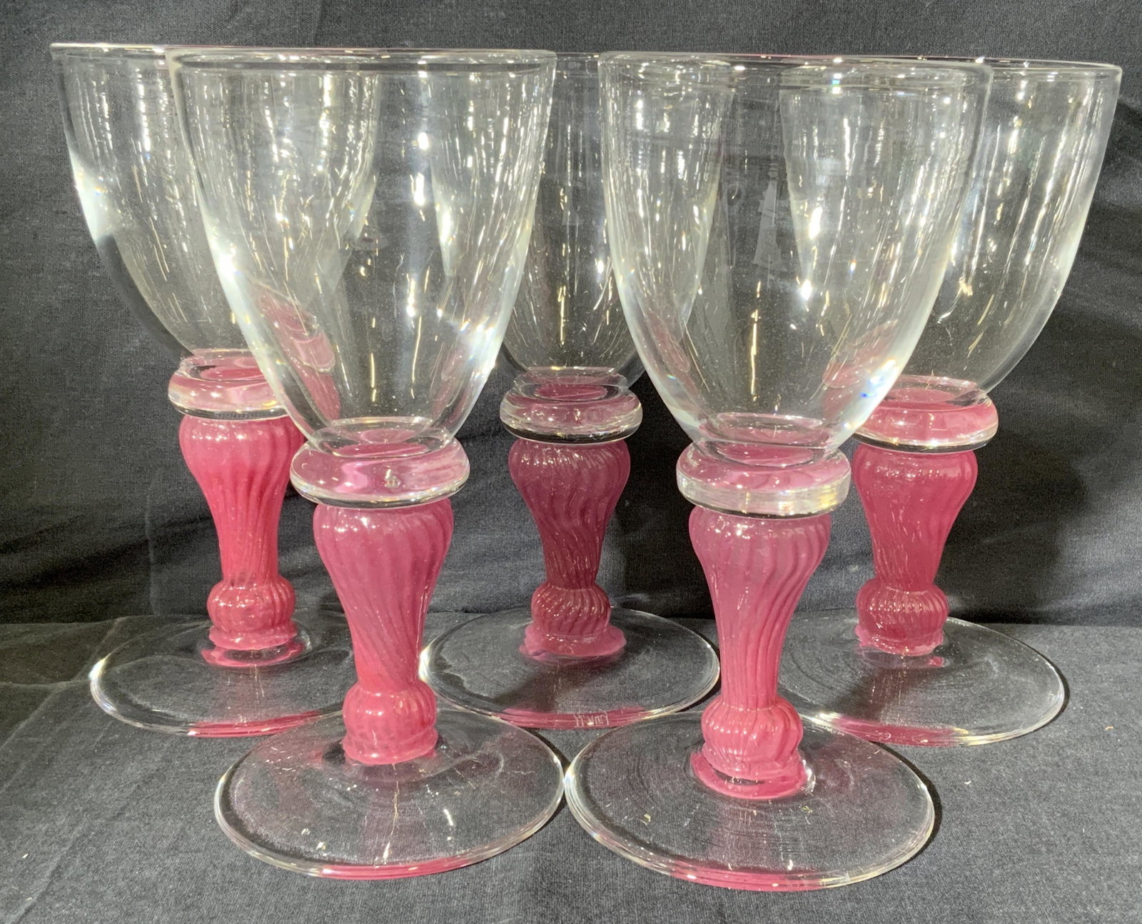 Lot 5 A. HAY Crystal Stemmed Goblets: Lot 5 A. HAY Crystal Stemmed Goblets, signature to underside reads A. HAY, clear base and cup, pink ridged stem, measures 8 x 3 3/4 x 3 3/4 inches, surface wear to piece. A. HAY Crystal, A. HAY goblet