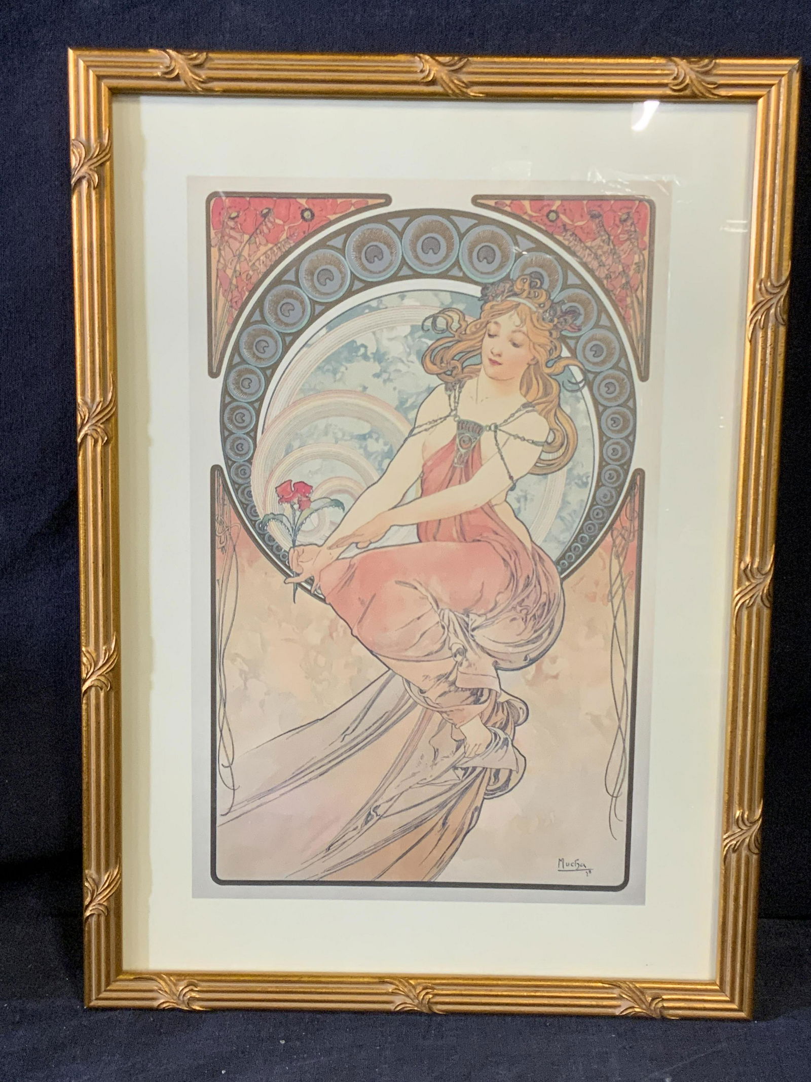Art Nouveau MUCHA Lithograph of Woman: Art Nouveau MUCHA Lithograph of Woman, shows artist signature to lower right reads MUCHA 38, subject a woman seated on circular ring, while wearing a draped dress and decorative clown, she is also see