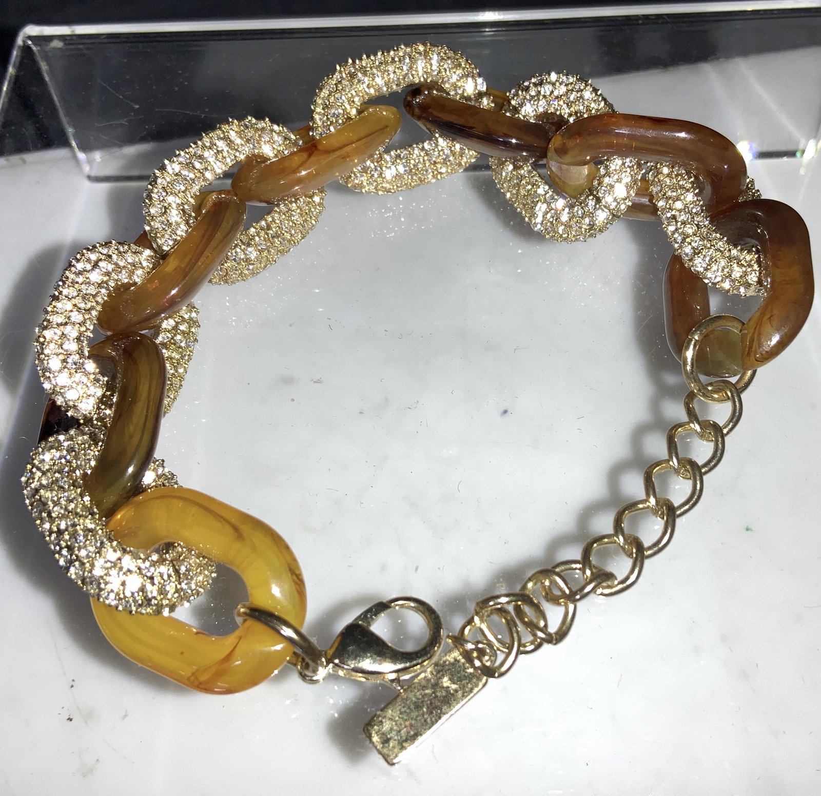 BAUBLEAR CHUNKT CRYSTAL CHAIN BRACELET: Chain link bracelet with diamante crystal links and amber resin links. Signed Baubler on charm. Adjustable length 7.24 - 9 in. Links almost 1 in. Comes with Bloomingdales gift box Luxury Estate bracel