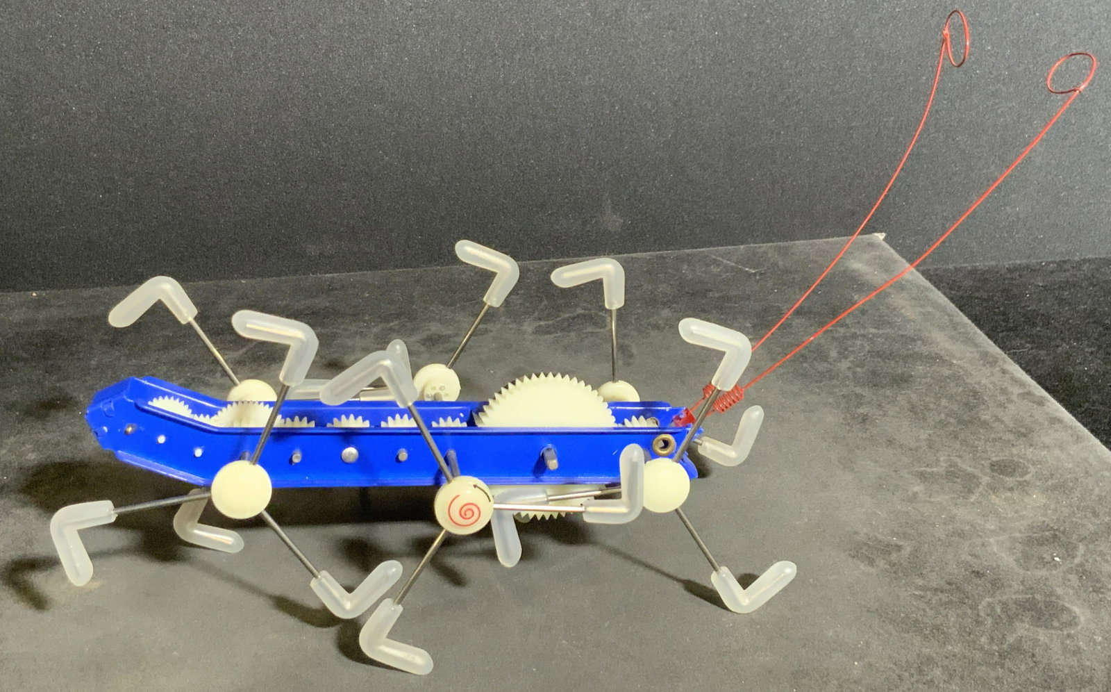 Collectible Wind-Up Insect Toy: A wind-up insect toy crafted from composite, plastics, and metal materials. Measures approx 3H x 5.5W in. Not tested for working condition. Wind up toys, collectibles, childrens toys, decorative objec