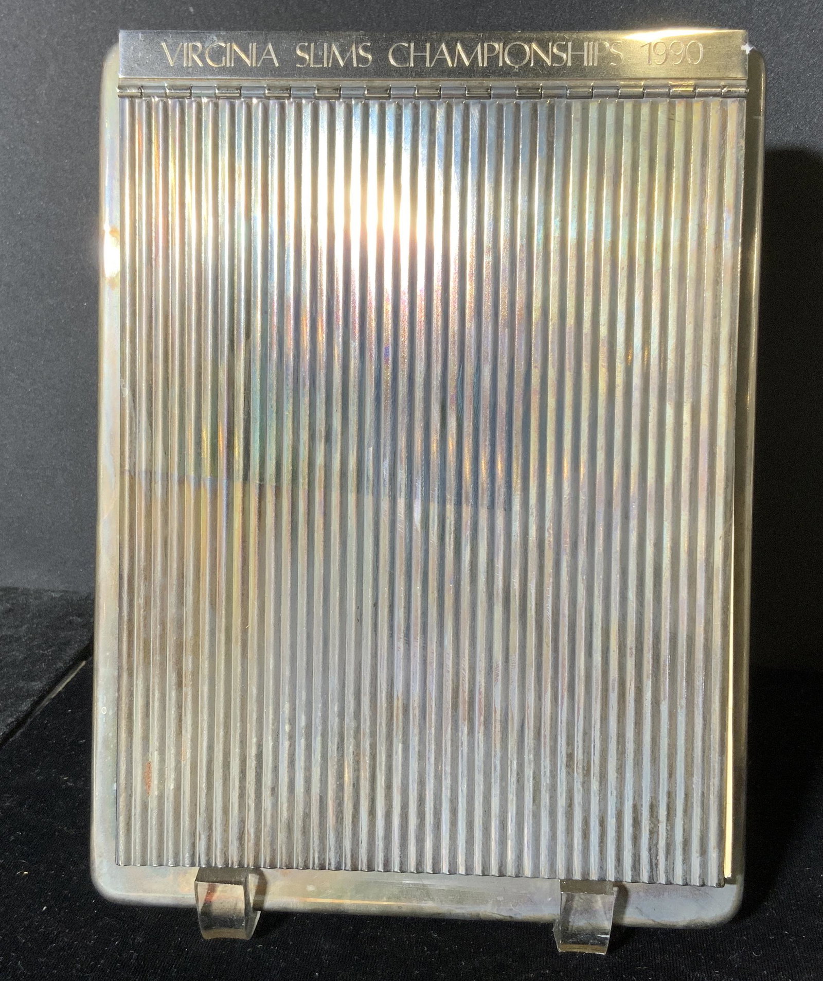 VIRGINIA SLIMS 1990 Appointment Book: Virginia Slims 1990 appointment book. Metal cover, possibly silver plated. Wear is consistent with age and use. Measures approx 9 inches long, and 6.75 inches w. Home decor, decorative accessories, ap
