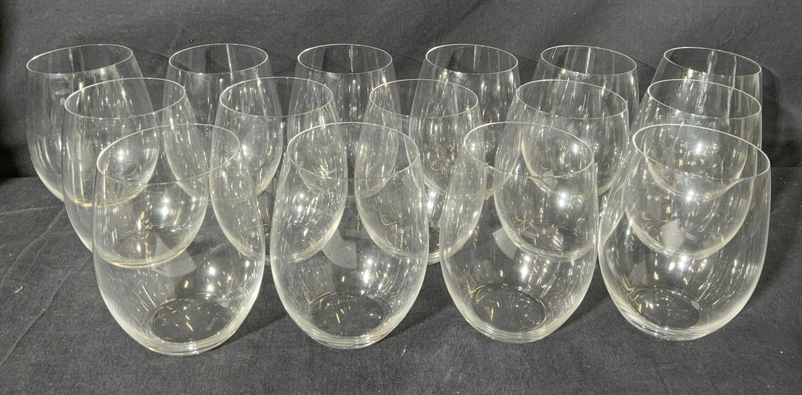 Lot 15 RIEDEL Crystal Stemless Wine Glasses: Lot 15 RIEDEL Crystal Stemless Wine Glasses, inscription to underside reads RIEDEL, measures 5 inches tall, surface wear to pieces. Glassware, crystal ware, wine glasses, stemless wine glasses, glassw