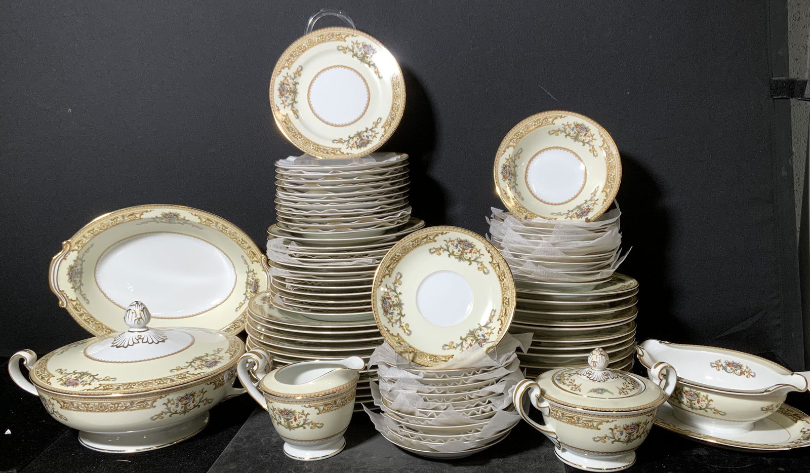 NORITAKE Ceramic Serving Set, Japan: Hallmark reads Noritake China Japan 5031 Crestwood. 12 soup bowls, 12 dinner plates, 12 bread plates, 12 desert plates, 11 saucers, 10 desert bowls, 1 lidded tureen, 1 handled oval bowl, 1 creamer, 1