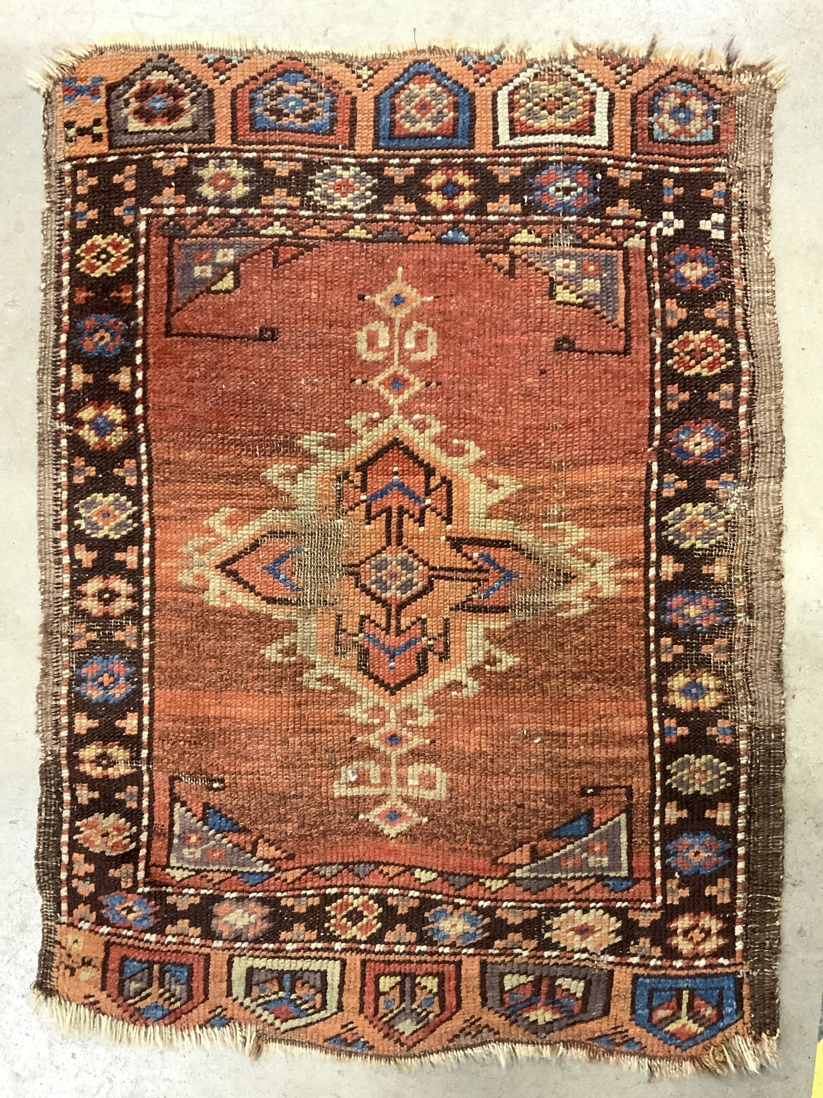 Antique Petite Handmade Wool Area Rug: Rug is handmade and wool. Piece is vintage possibly antique. Rug has intricate multi toned geometric detail. Rug is possibly Turkish. Piece measures approx 30 inches tall inches 22 inches wide. Rug, c
