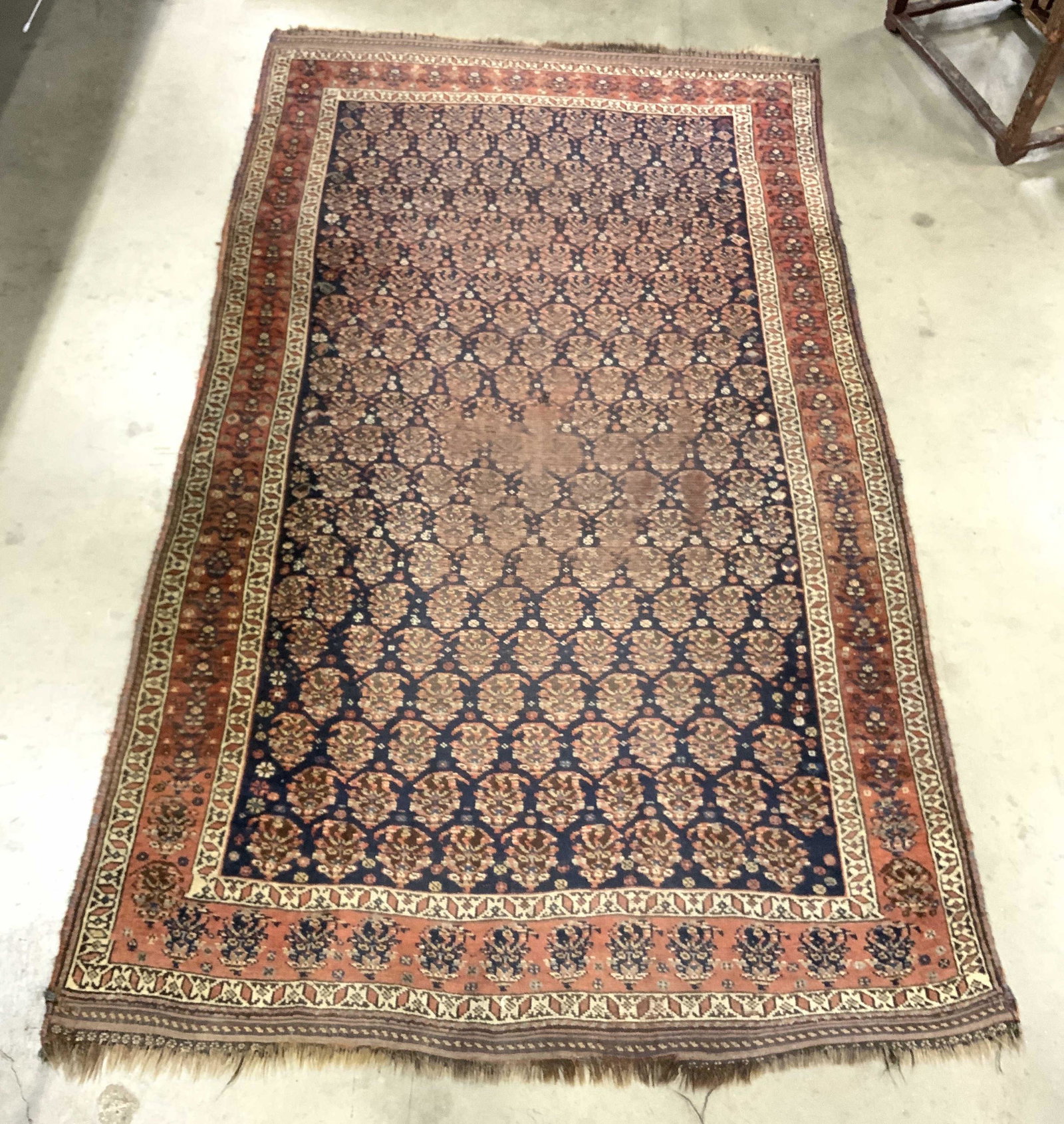 Vintage Fringed Handmade Wool Area Rug: Rug is vintage possibly antique. Piece is handmade and wool. Rug has short fringes. Rug has intricate multi toned floral & geometric detail. Measures approx 96 inches long 57 inches wide. Rug, carpet,
