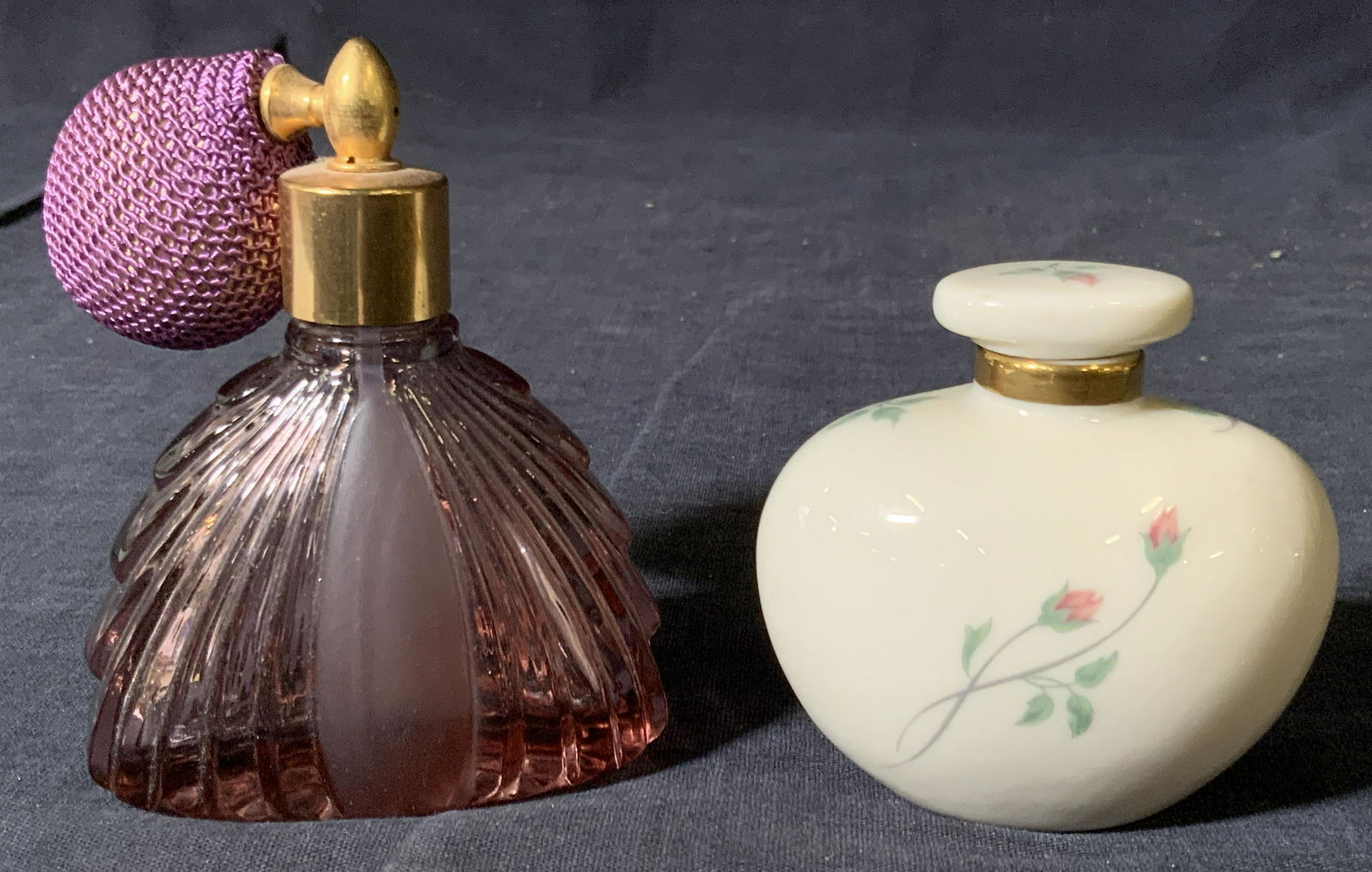 Crystal Handle Holders & Glass Perfume Bottles: A group lot of 4 items, 2 crystal Handle stick holders with flared saw tooth rims and 1 porcelain perfume bottle marked Lenox on underside, with flowers painted on exterior, and 1 purple glass perfume