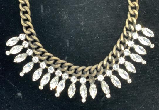 Dramatic Rhinestone Collar Necklace on Curd Chain: Statement collar necklace, adjustable, Marquis and round rhinestones, Marquis stone measure 15 mm long. Necklace 14- 16 in. Weighted piece. Has an Art Deco vibe with bronze toned curd chain. Needs 1 r