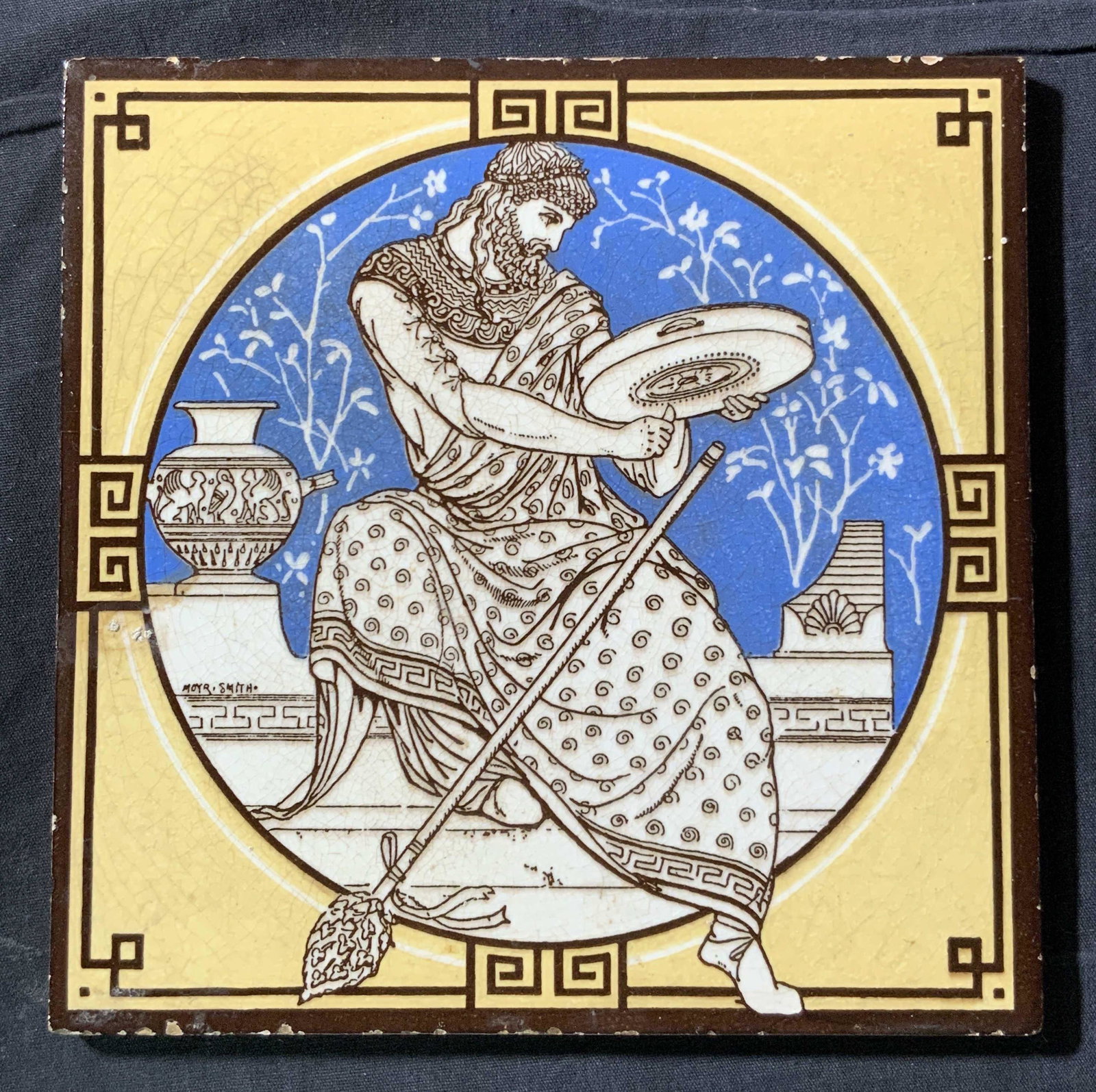 MINTON Greek God Dionysus Painted Tile: A painted tile, marked Minton on underside, obverse is painted to depict the god Dionysus, (Bacchus in Rome) God of wine, fruitfulness and vegetation and ecstasy, painted in a traditional Greco Roman 