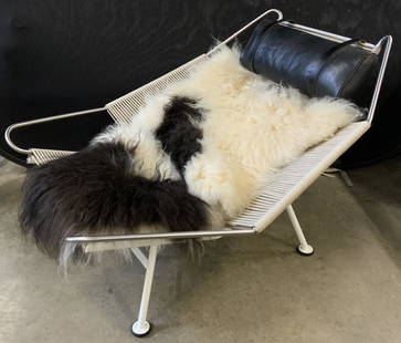 MOBLER HANS J WEGNER Halyard Lounge Chair: Hans J Wegner flag halyard chair. White, lacquered, steel base. Plaited halyard seat and back. Designed by Hans J Wegner, manufactured by PP MOBLER. Frame stamped PP 19281. Includes sheepskin cushion.