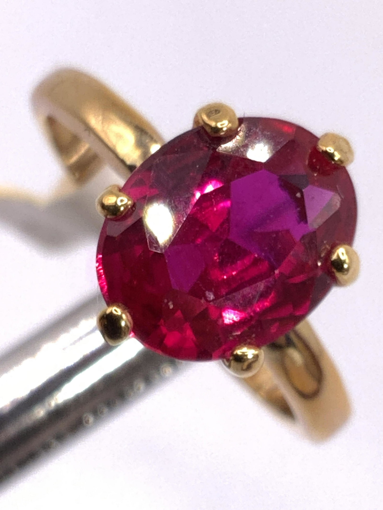 Vintage Faceted Red Crystal Solitaire Ring, Box: A vintage gold tone metal ring with a deep pink-red hued faceted solitaire crystal. Size 6. Possibly never used. Tag still affixed to ring. Contained in a red ring box. Some wear to pieces consistent 