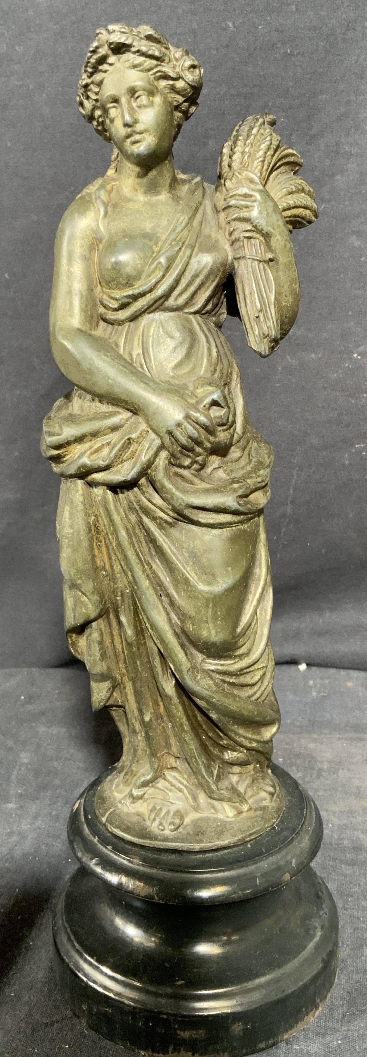 Cast Metal Caryatid Sculpture on Wood Base: Cast Metal Caryatid Sculpture on Wood Base, possibly bronze, measures 3 1/2 w x 11 1/4 h inches, wear consistent with age and use. Art, artwork, tabletop art, home decor, Bronze, bronze sculpture, bro