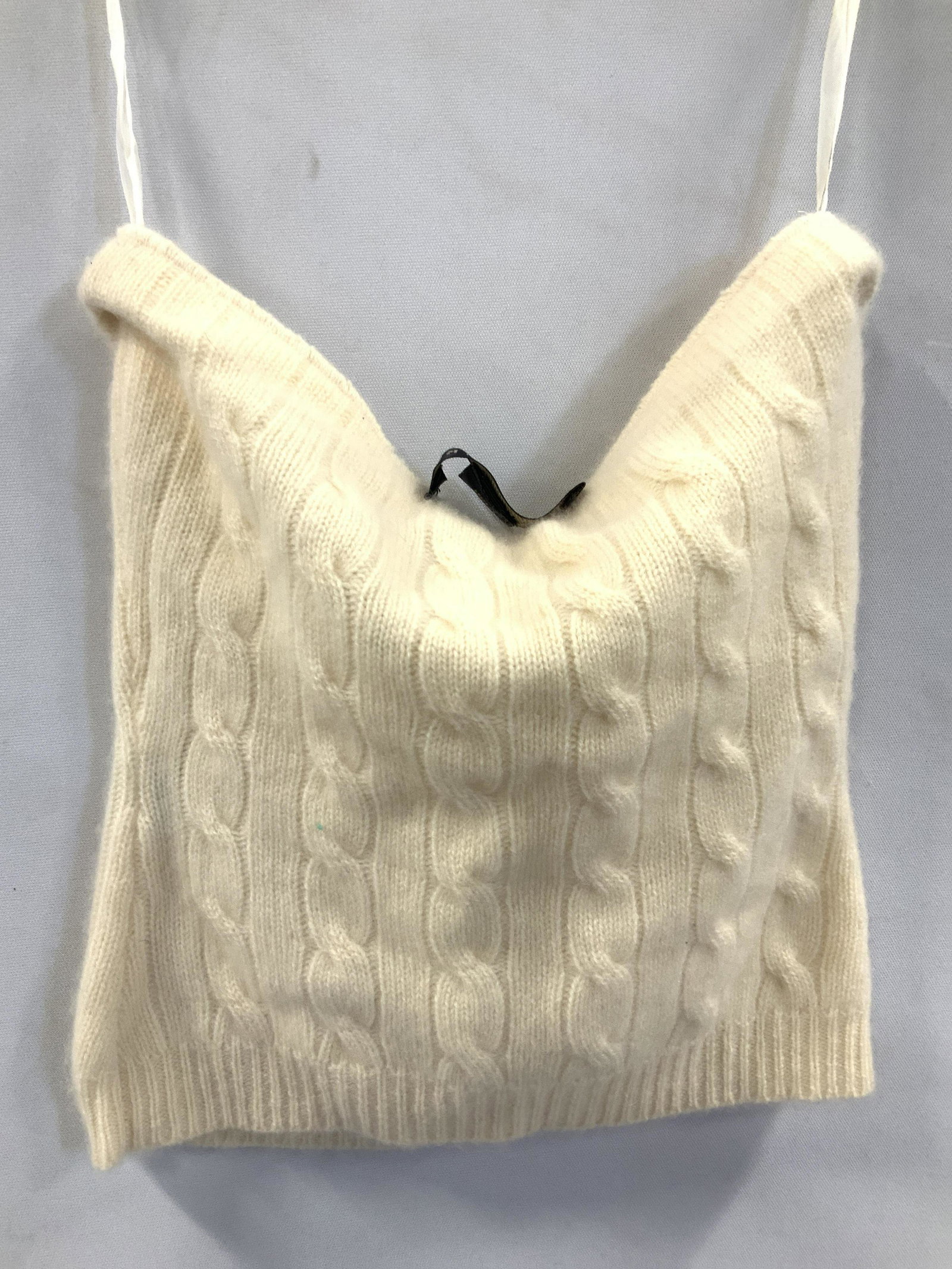 Ralph Lauren Cashmere Crop Top, XS: Ladies Vintage off white cashmere crop top, signed black label Ralph Lauren. Soft hand luxury knitwear, with top band stretch, handing loops. Measures 10.75 in. Long. Irregular with label stitched to 